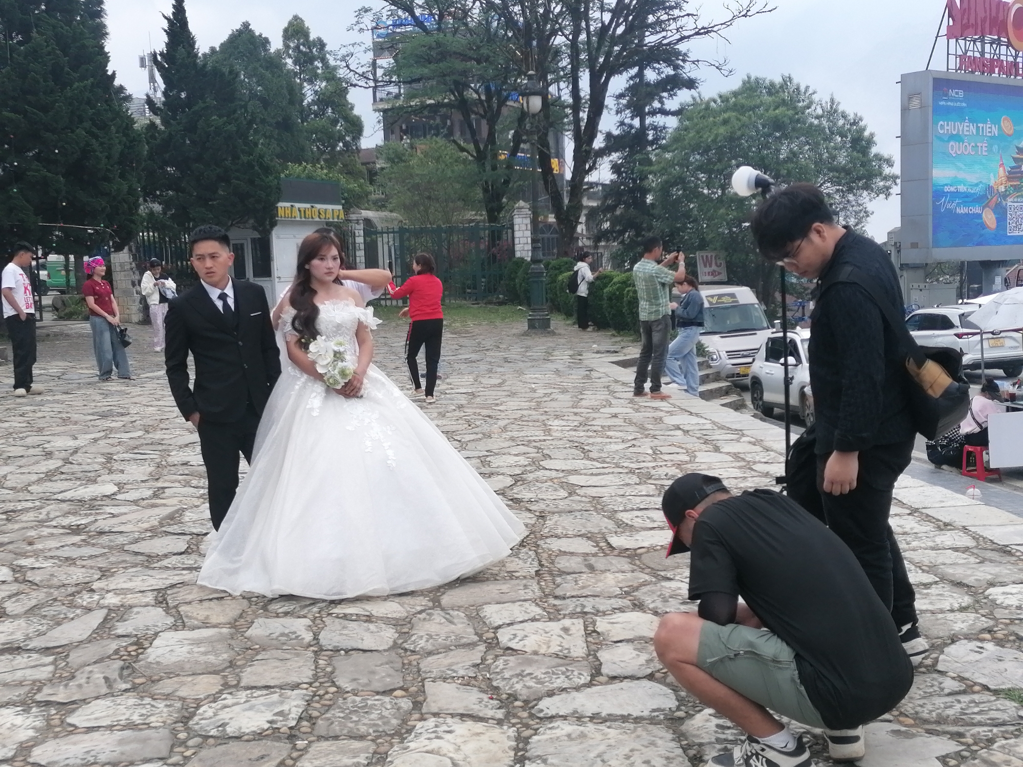 Wedding photoshoot captured on stone paved outdoor area