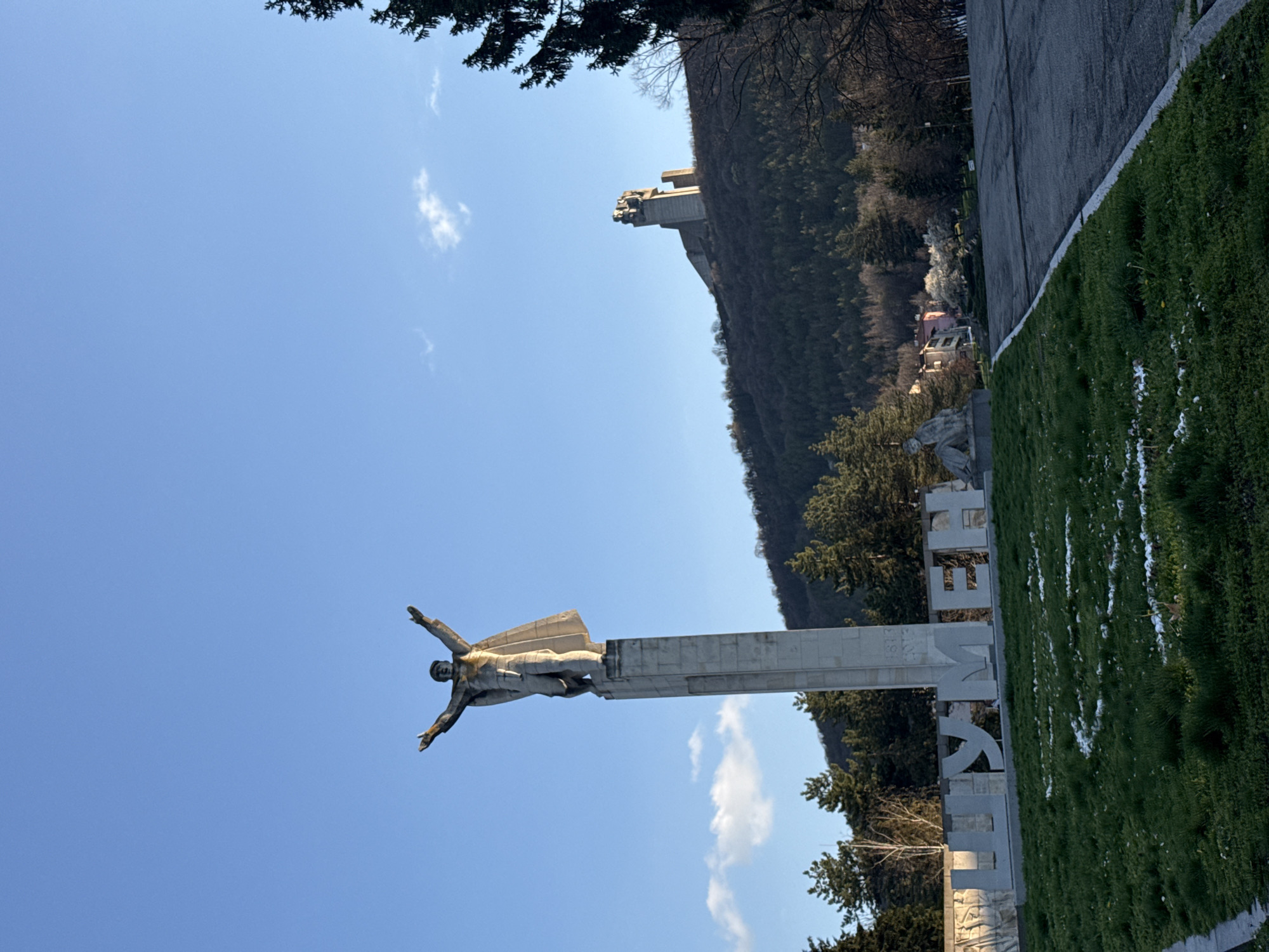 Tourist photographs historic Bulgarian monument in Shumen