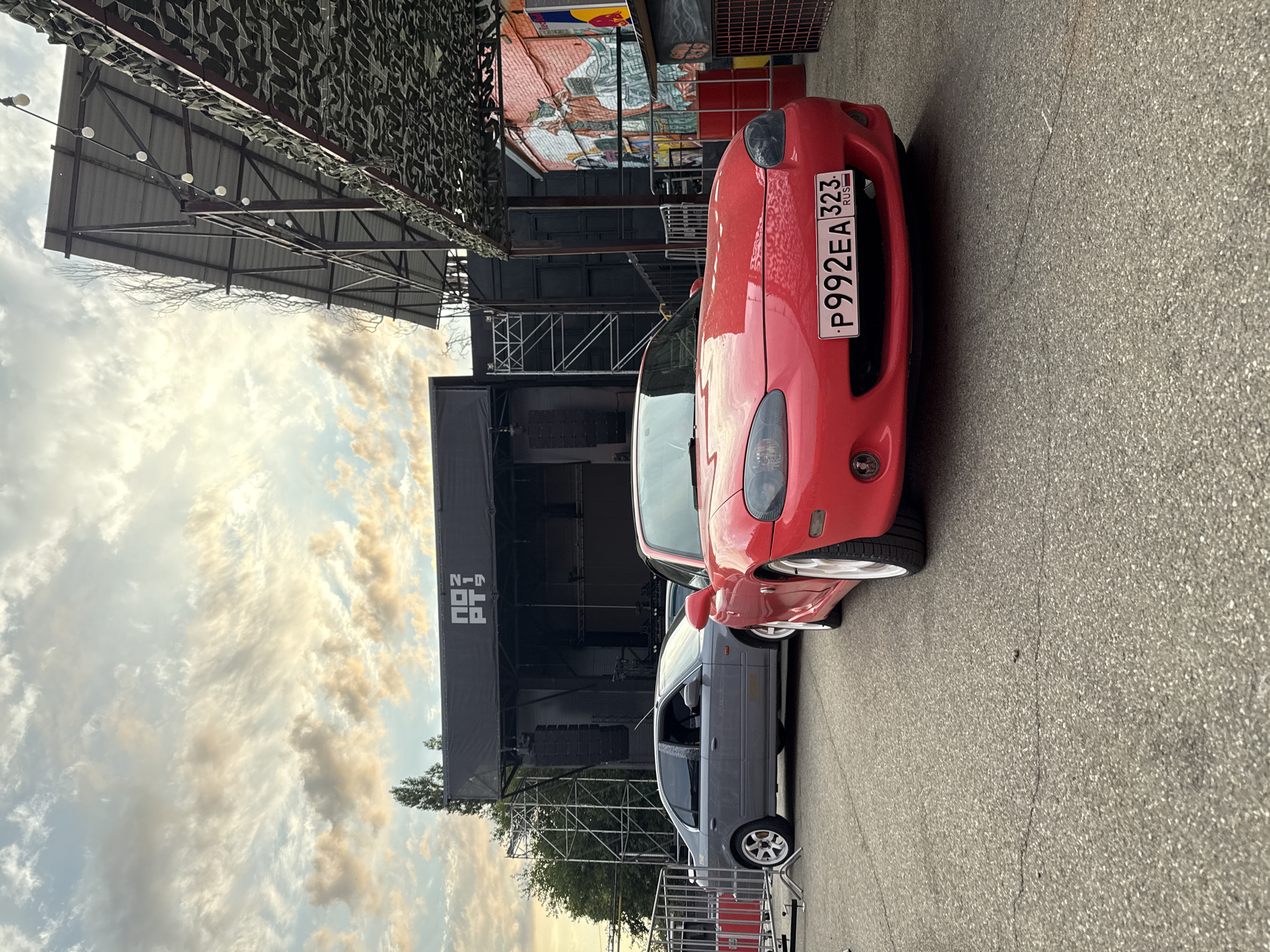 Street scenes and parked cars near a graffiti-heavy Krasnodar block