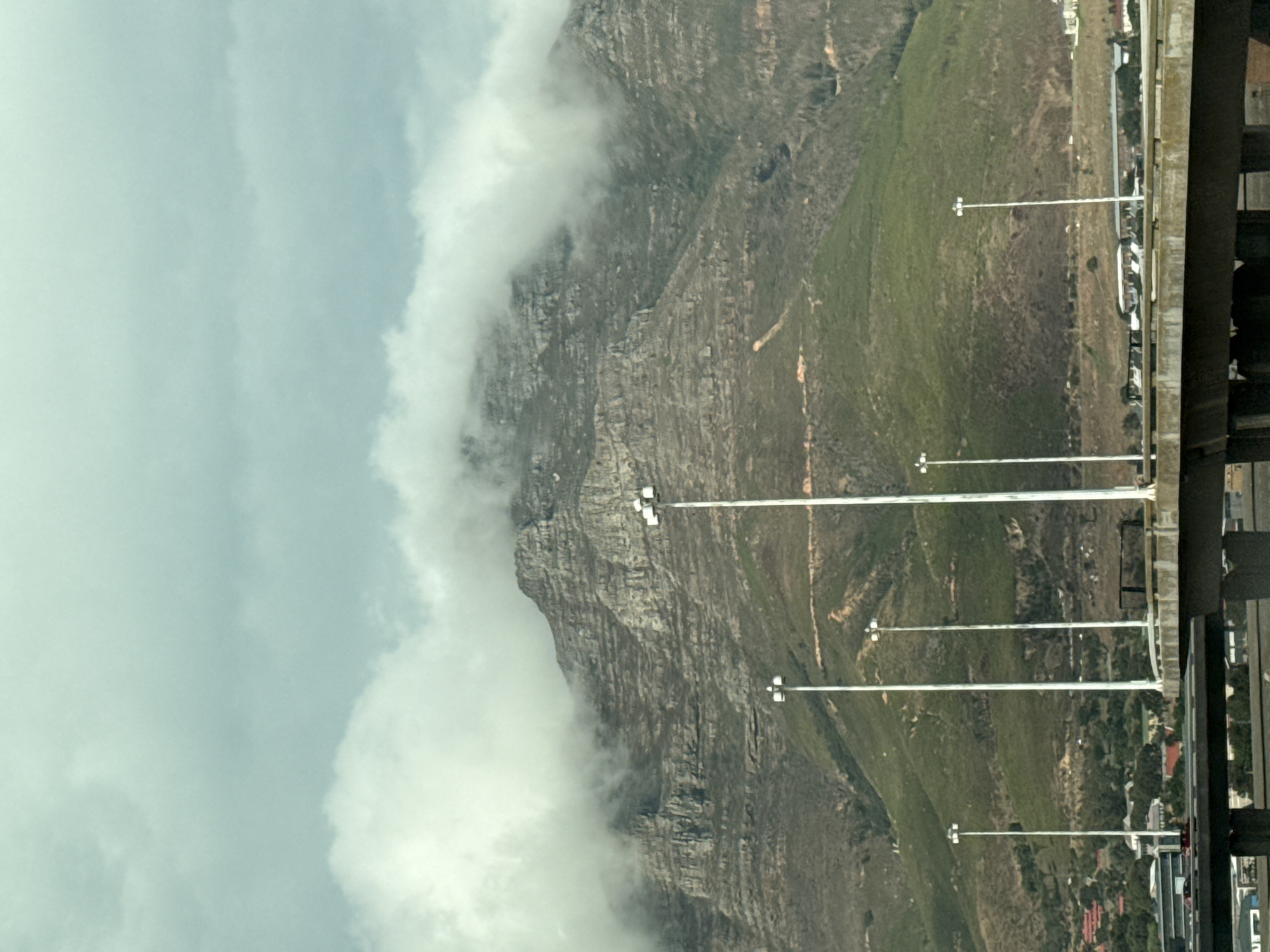 Clouds partially obscure Table Mountain peak in Cape Town