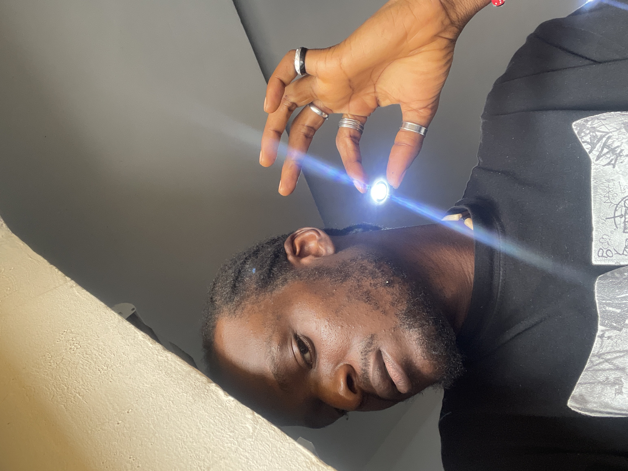 Close-up self-portraits in Abuja, styled with jewelry and attitude.
