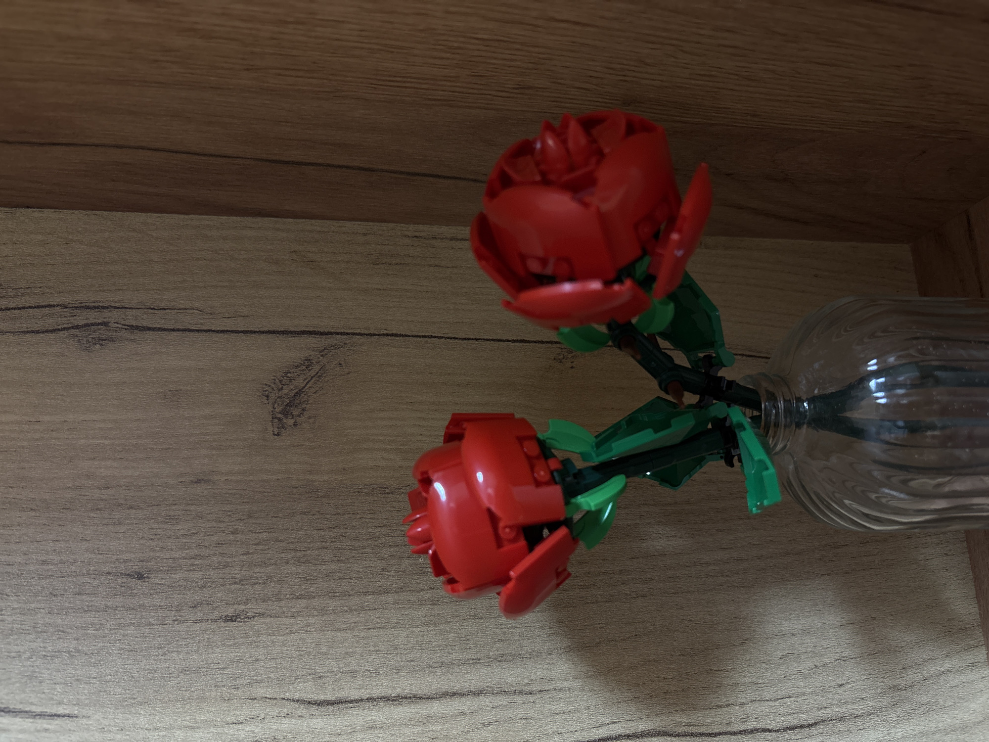 Red LEGO roses displayed in glass vase in Varna