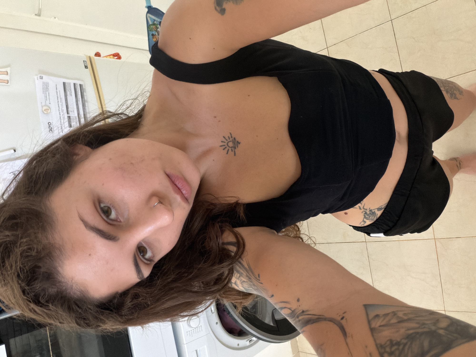 Woman takes selfies in Kiryat Bialik home