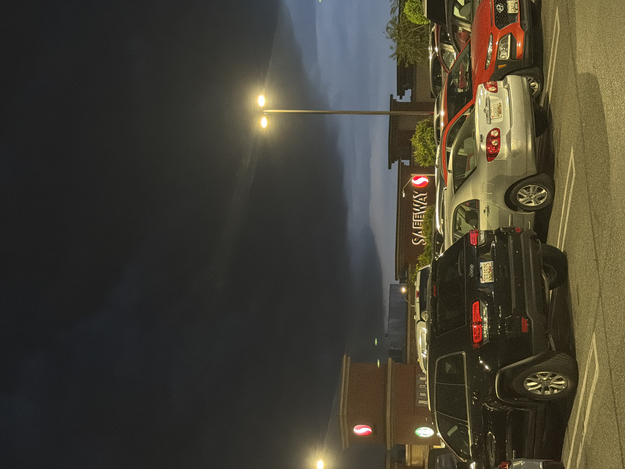 Nighttime parking lot scene documented at Olney Safeway store