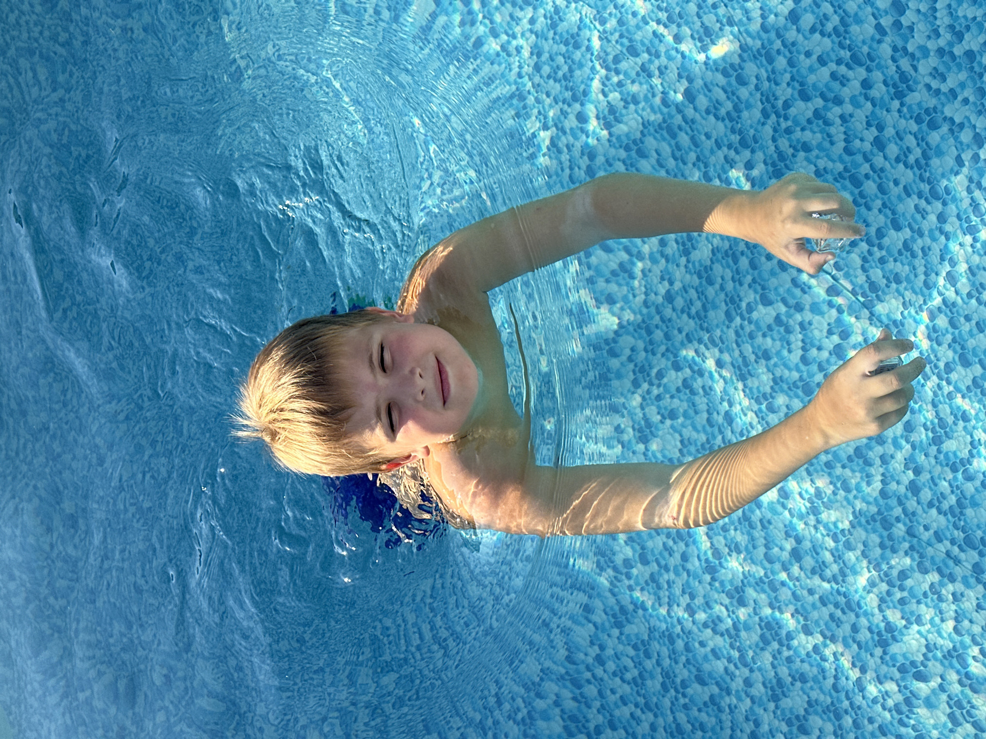 Pool and grass downtime in Samara on a summer afternoon