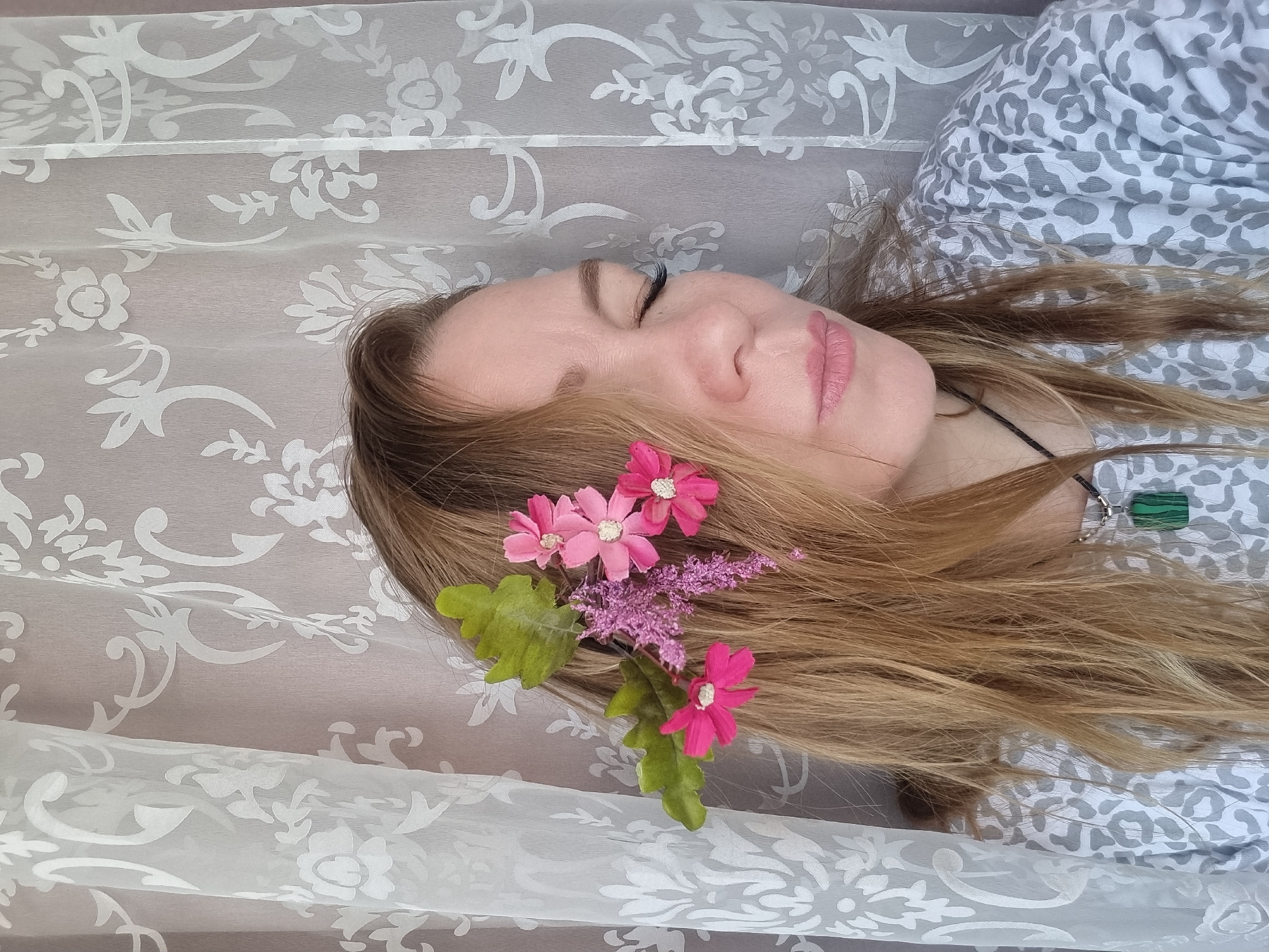 Woman with flower-adorned hair photographed in Chaikovsky portrait session