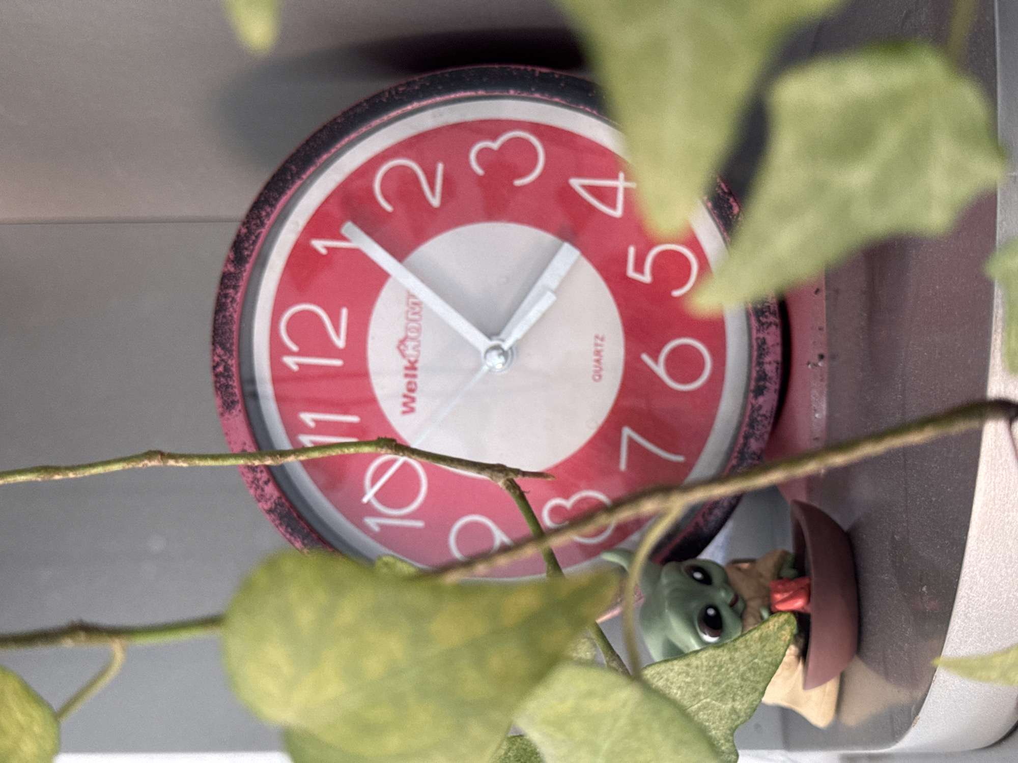 Clocks, watermelon, and Podgorica rooftops on a summer morning