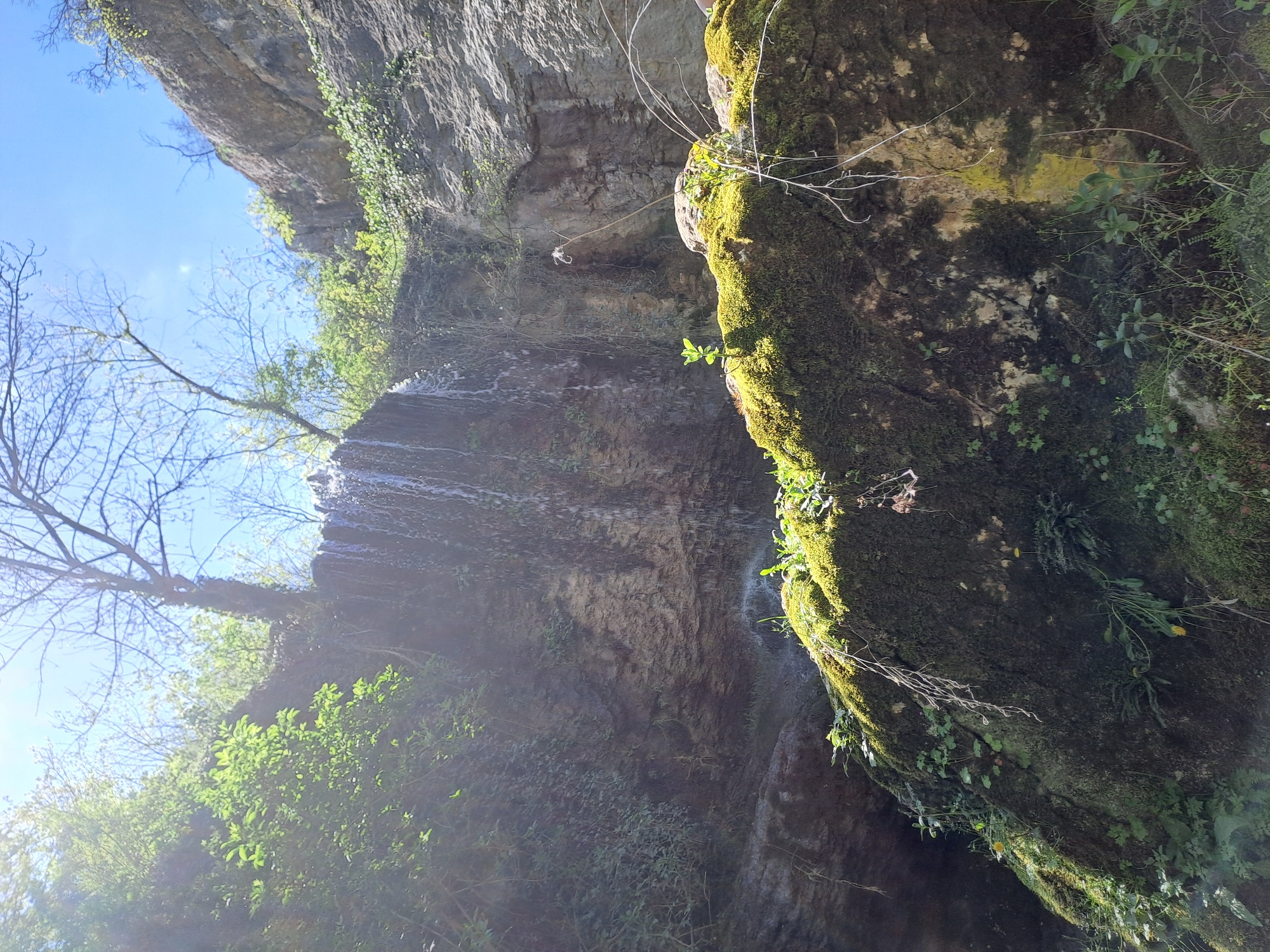 Waterfall observed cascading down rocky cliff in Veliko Tarnovo