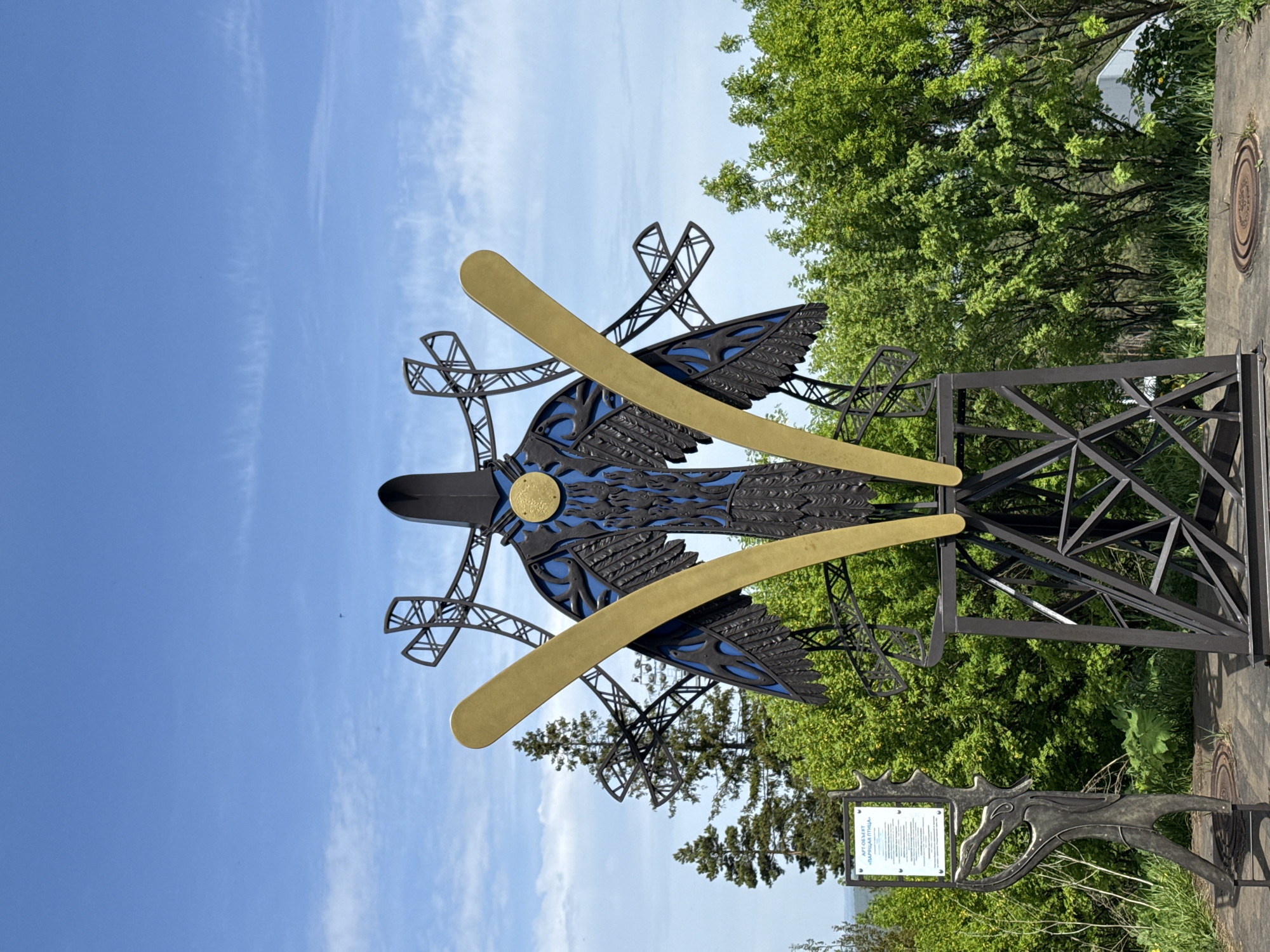 Morning park walk captures public art and spring nature scenes