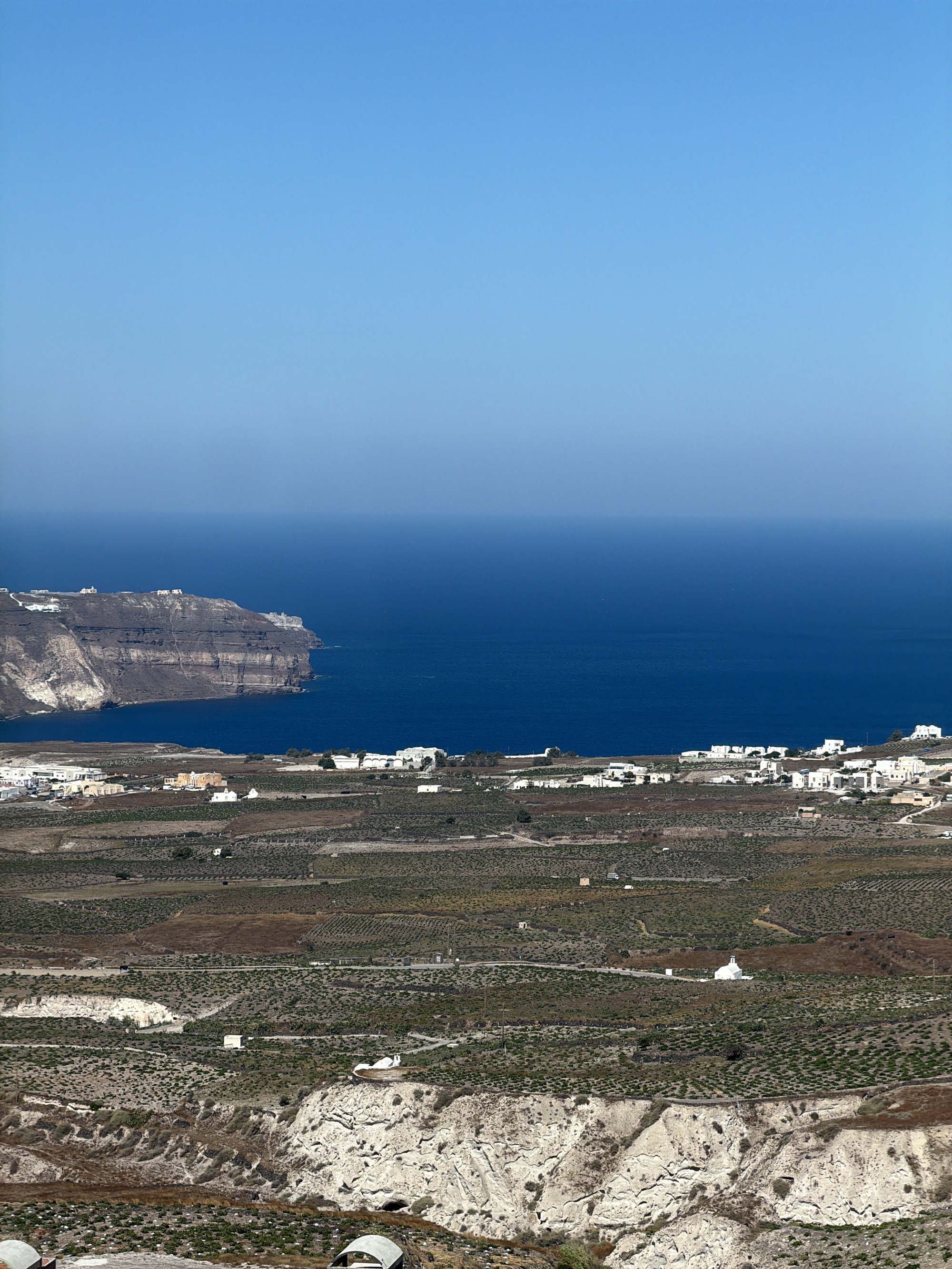Elevated view over Santorini's caldera rim and the Aegean Sea