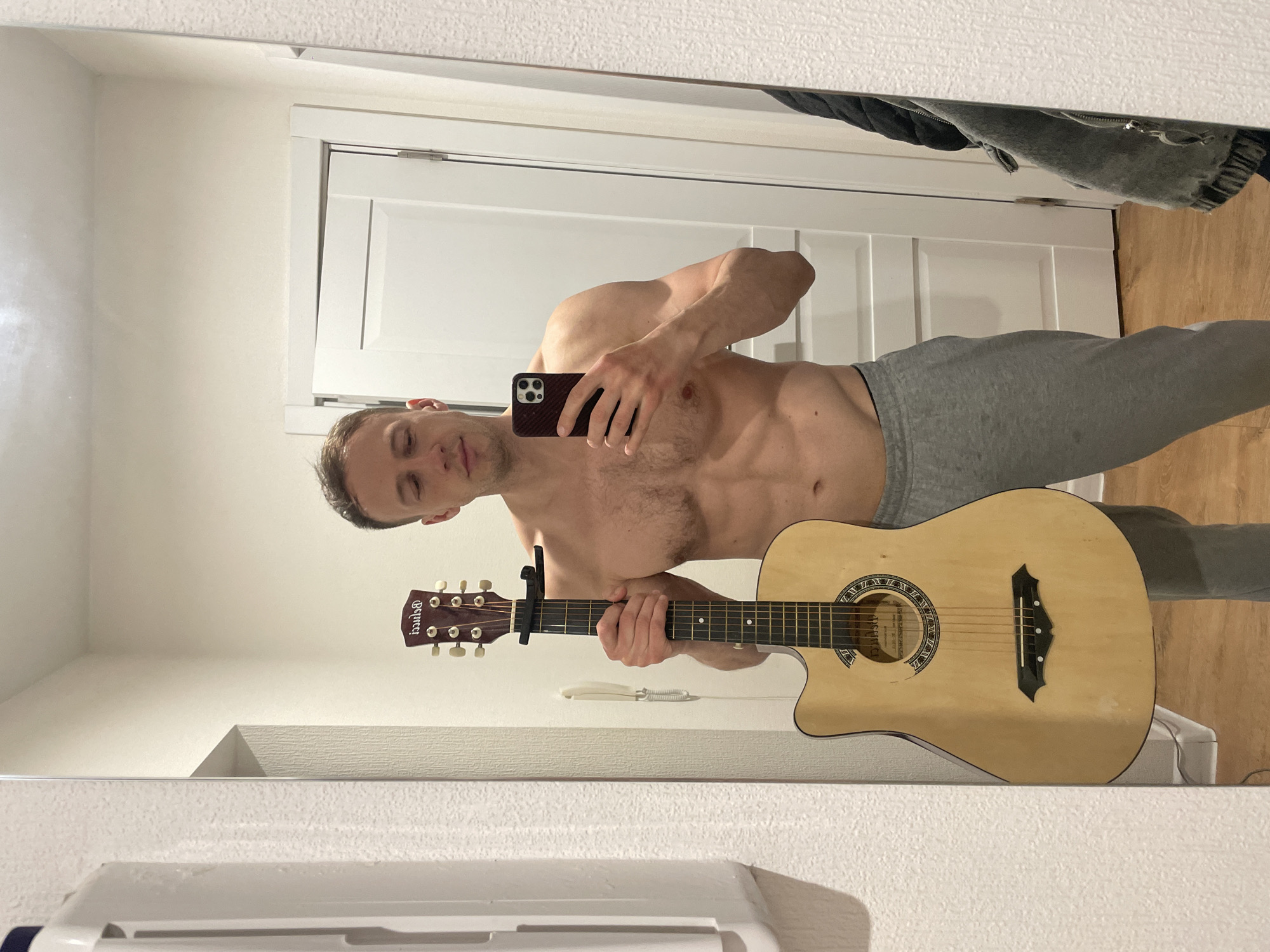 Man Takes Mirror Selfies With Guitar in Saint Petersburg