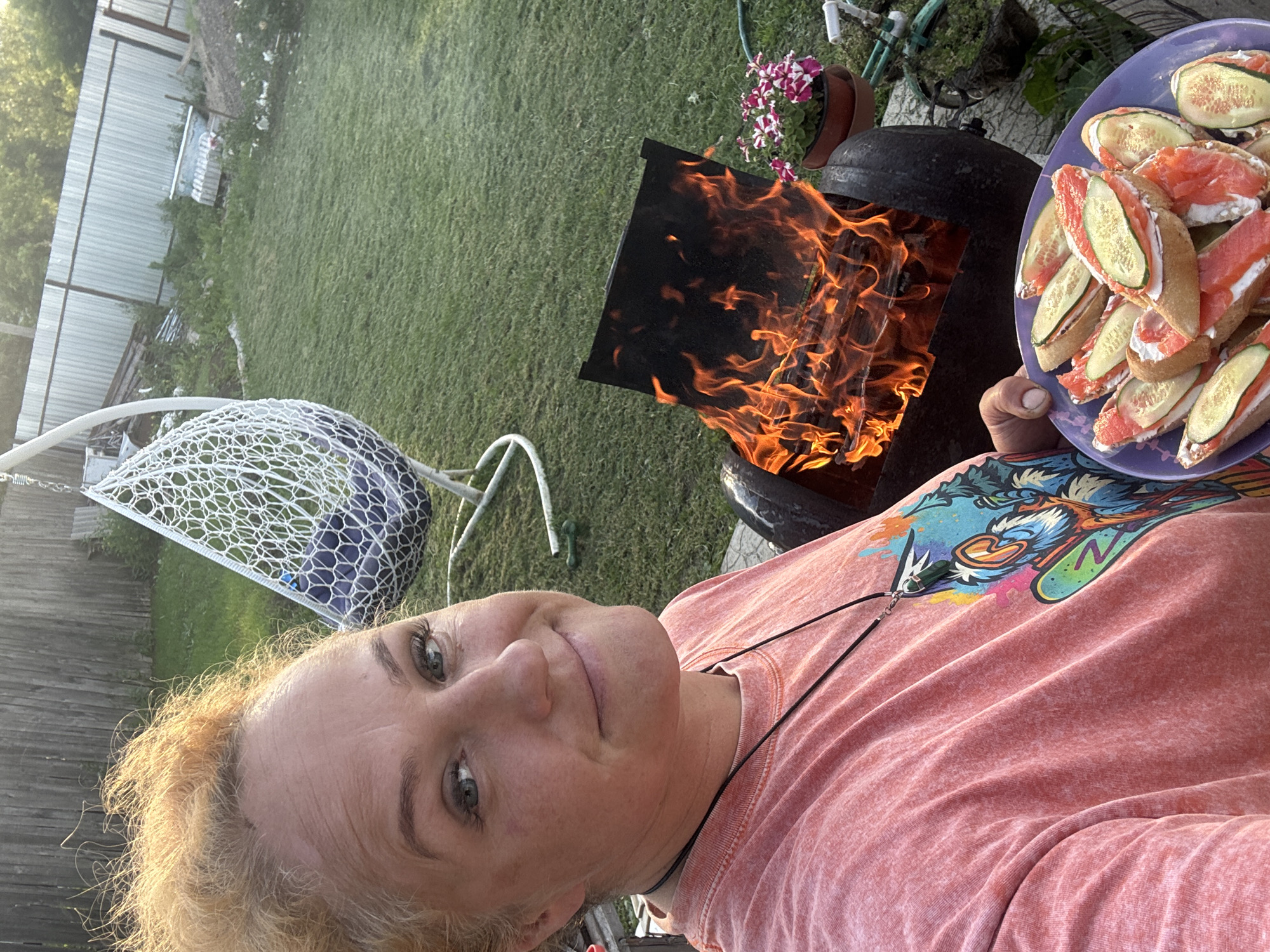 Backyard cookout in Chaikovsky with a boxer dog in tow