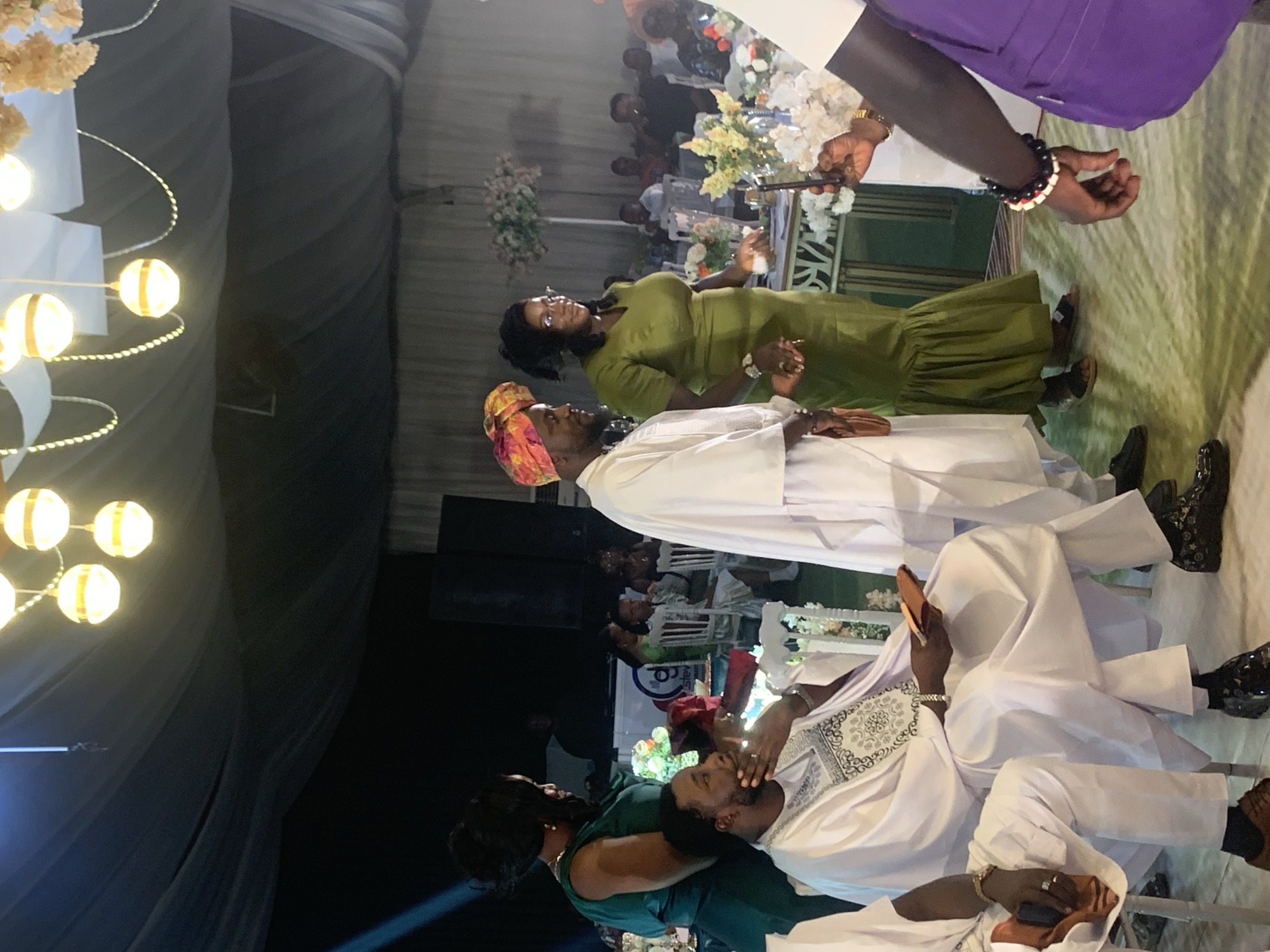 Wedding reception held in decorated event hall in Jos