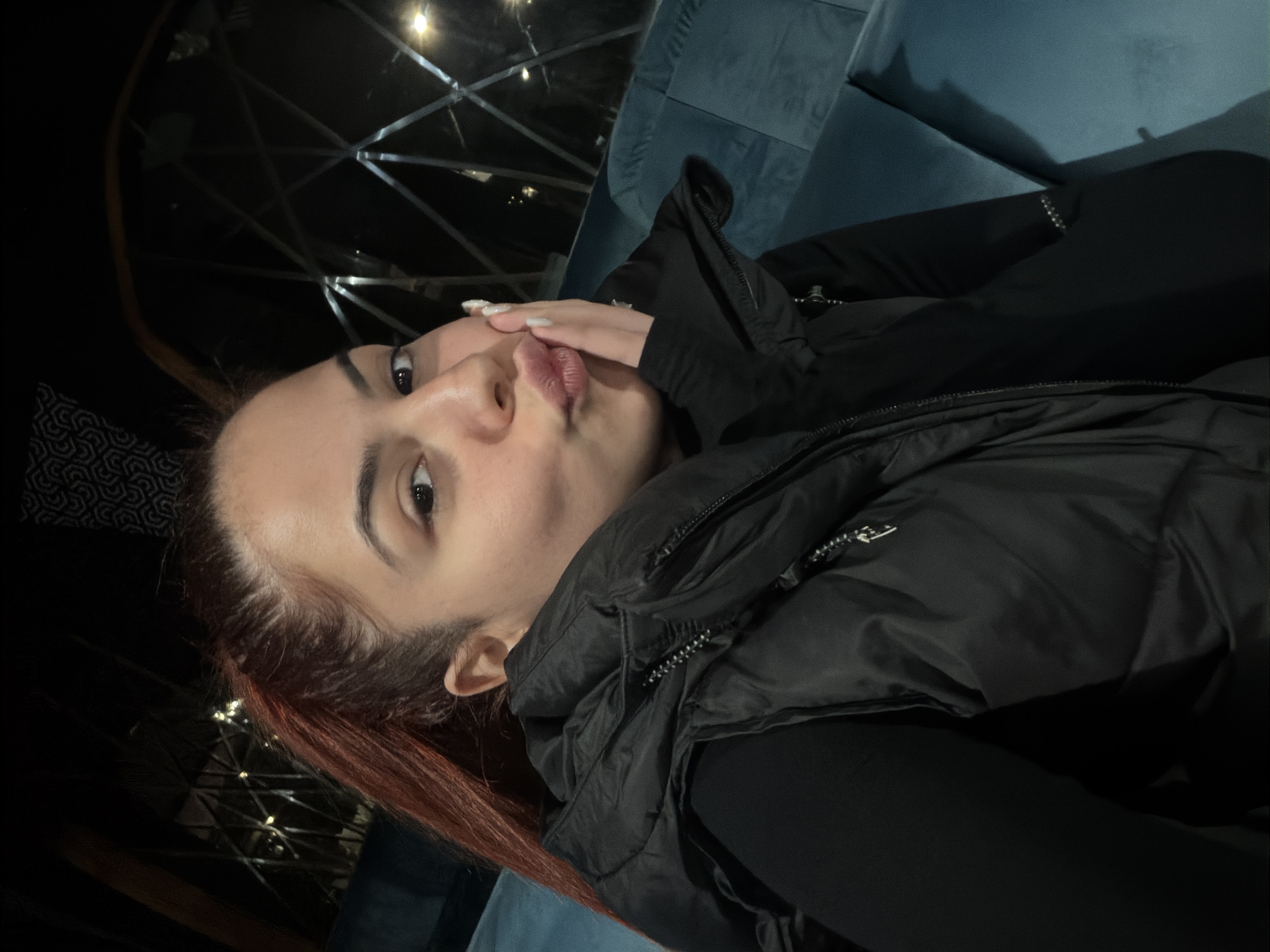 Woman makes kissing gesture in early morning Sofia