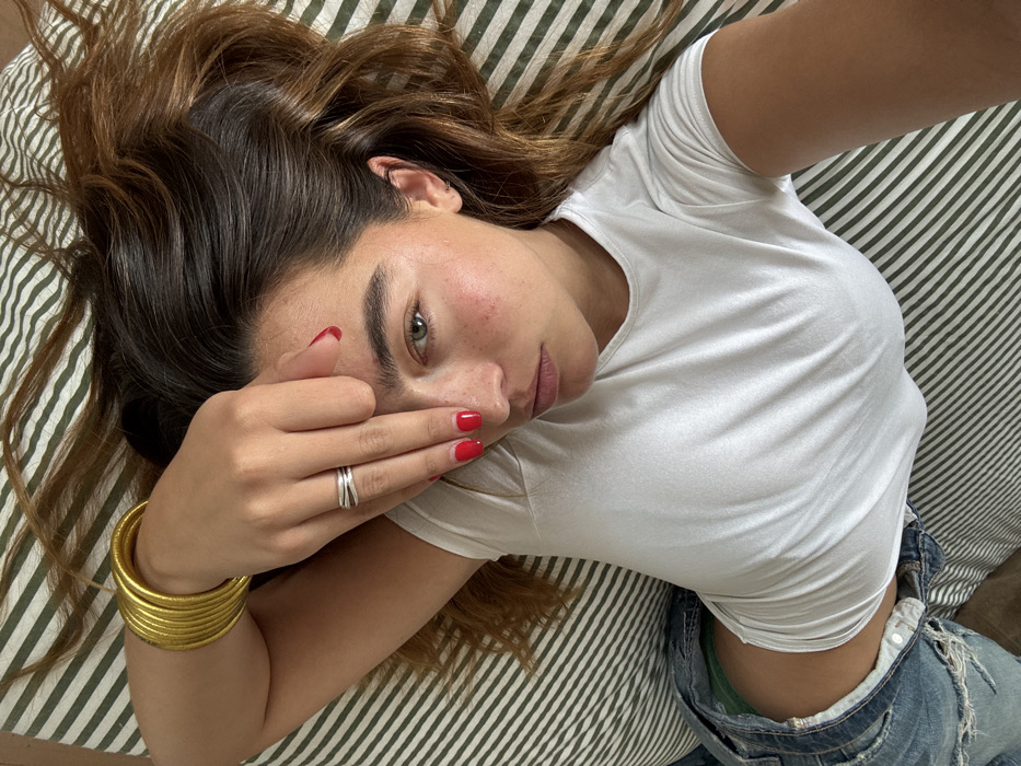 Woman resting on patterned bedding captured in Los Angeles memory