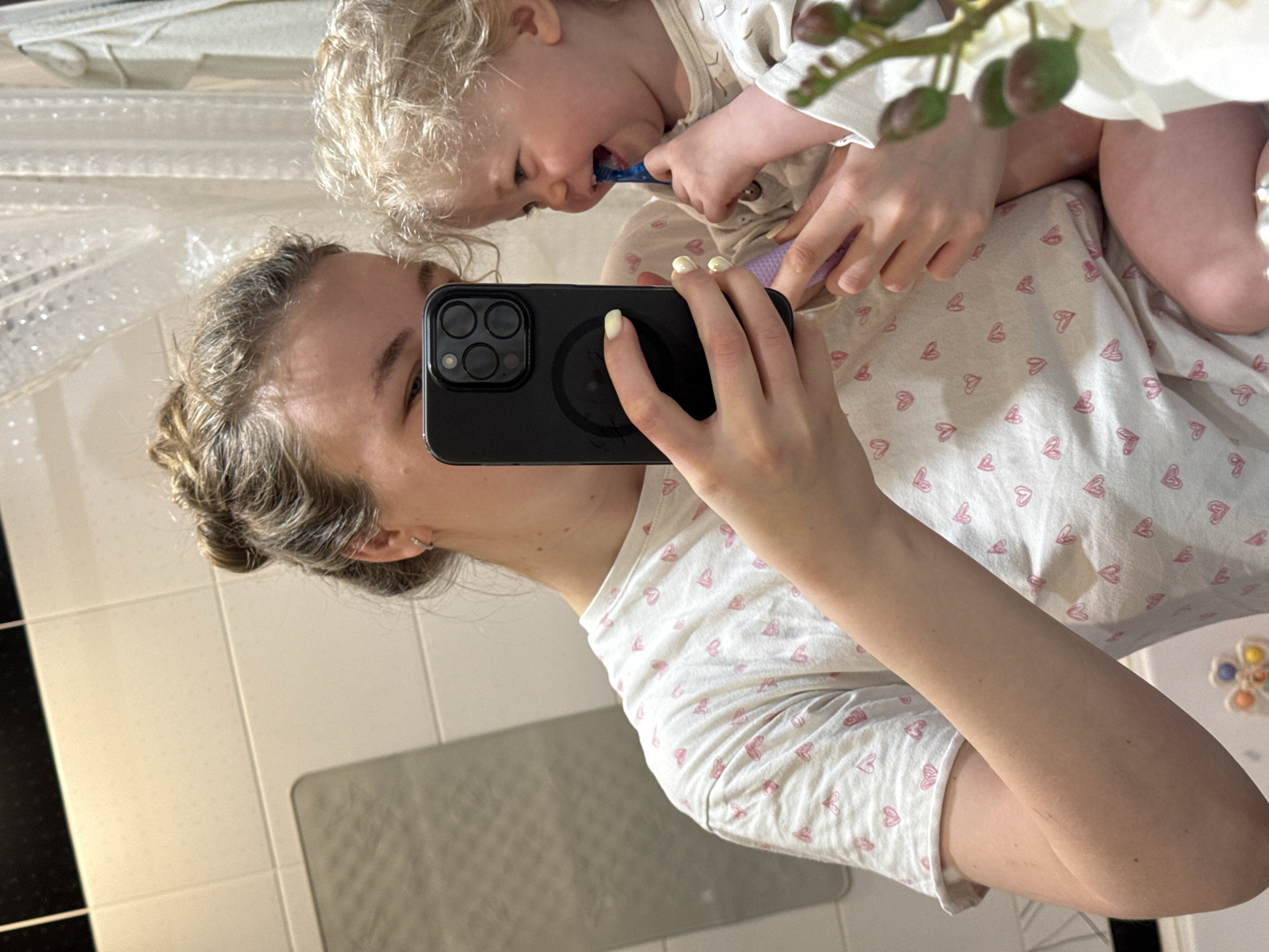 Early morning mother-child moments captured in bathroom and nursery