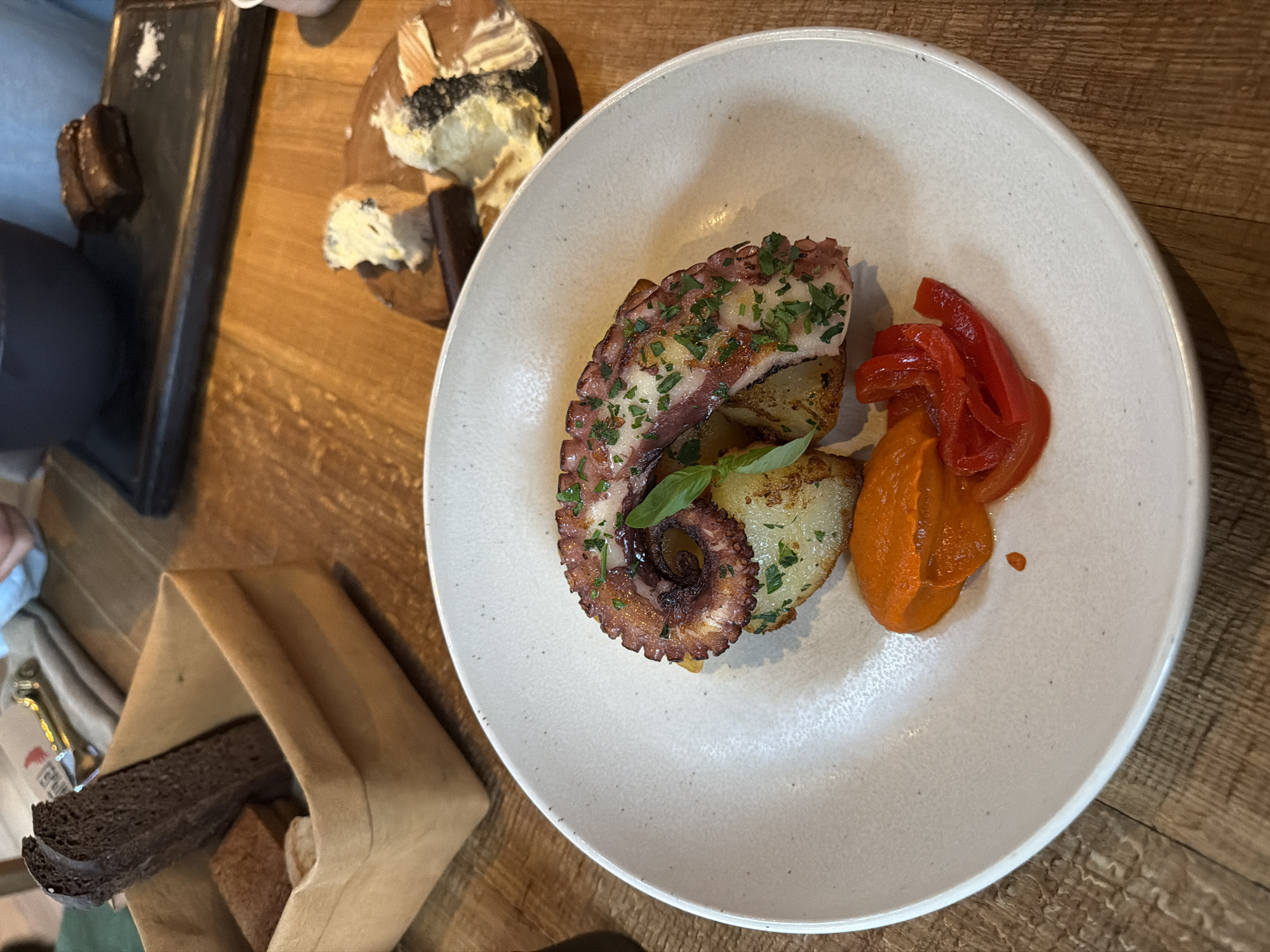 Grilled octopus meal documented at Moscow restaurant