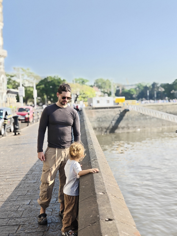 Father and child tour Mumbai landmarks during early morning hours