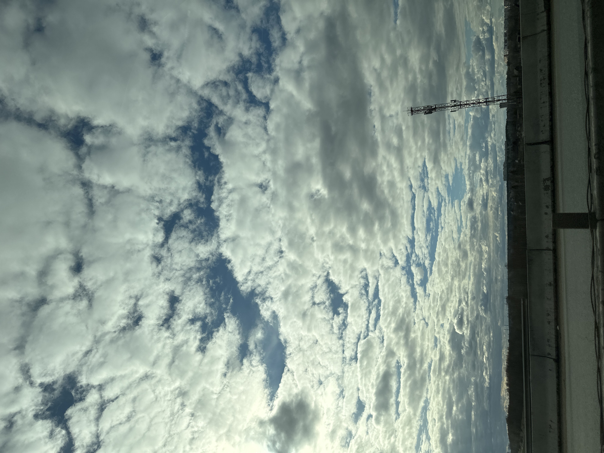 Cloudy skies observed over Кондратово, Russia with metal structure visible