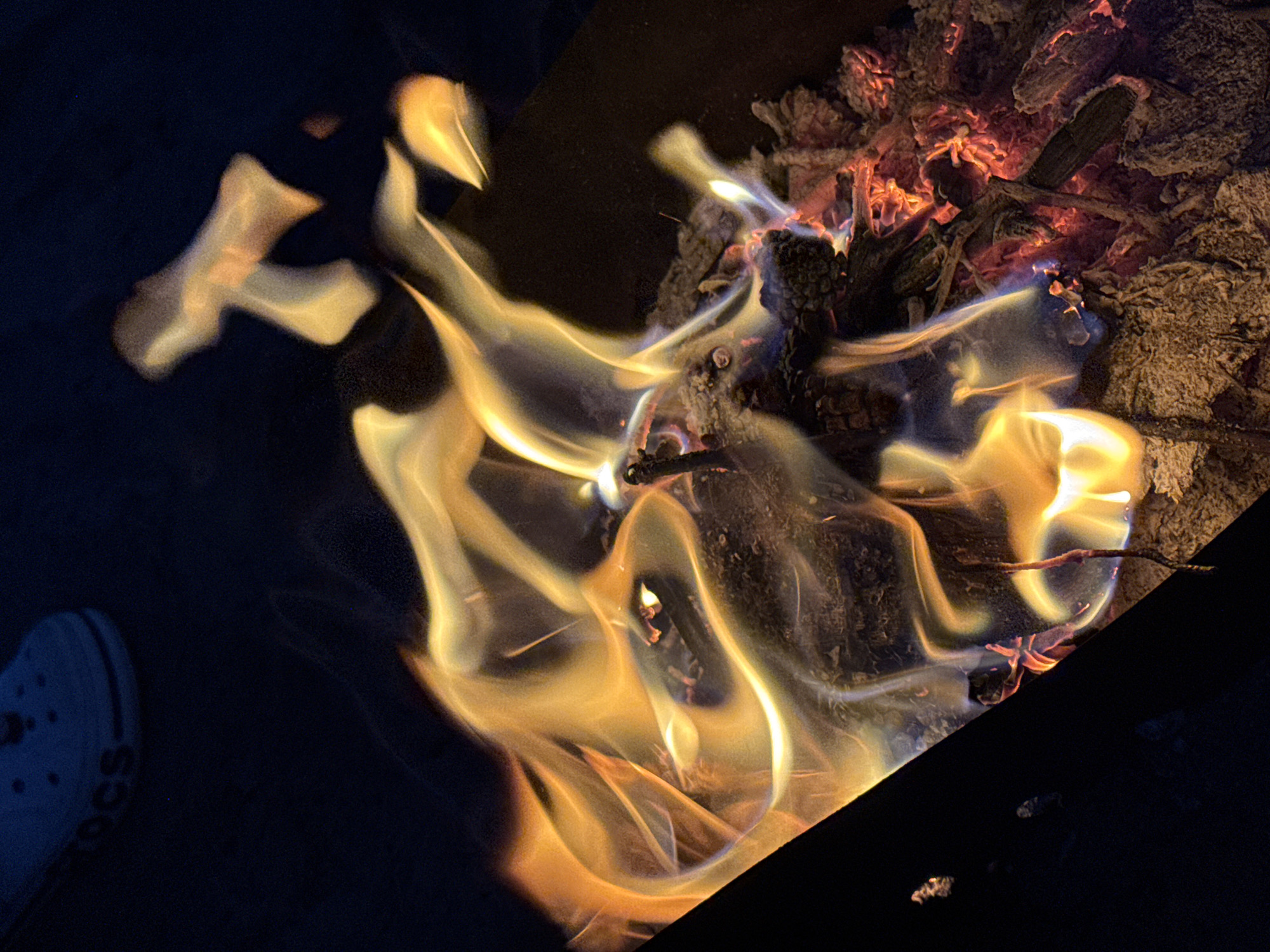 Campfire burning bright on a summer night in Russia