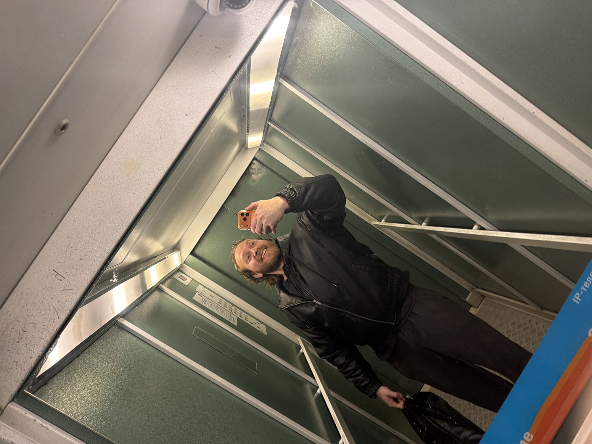 Bearded man photographs himself in Saint Petersburg morning scenes