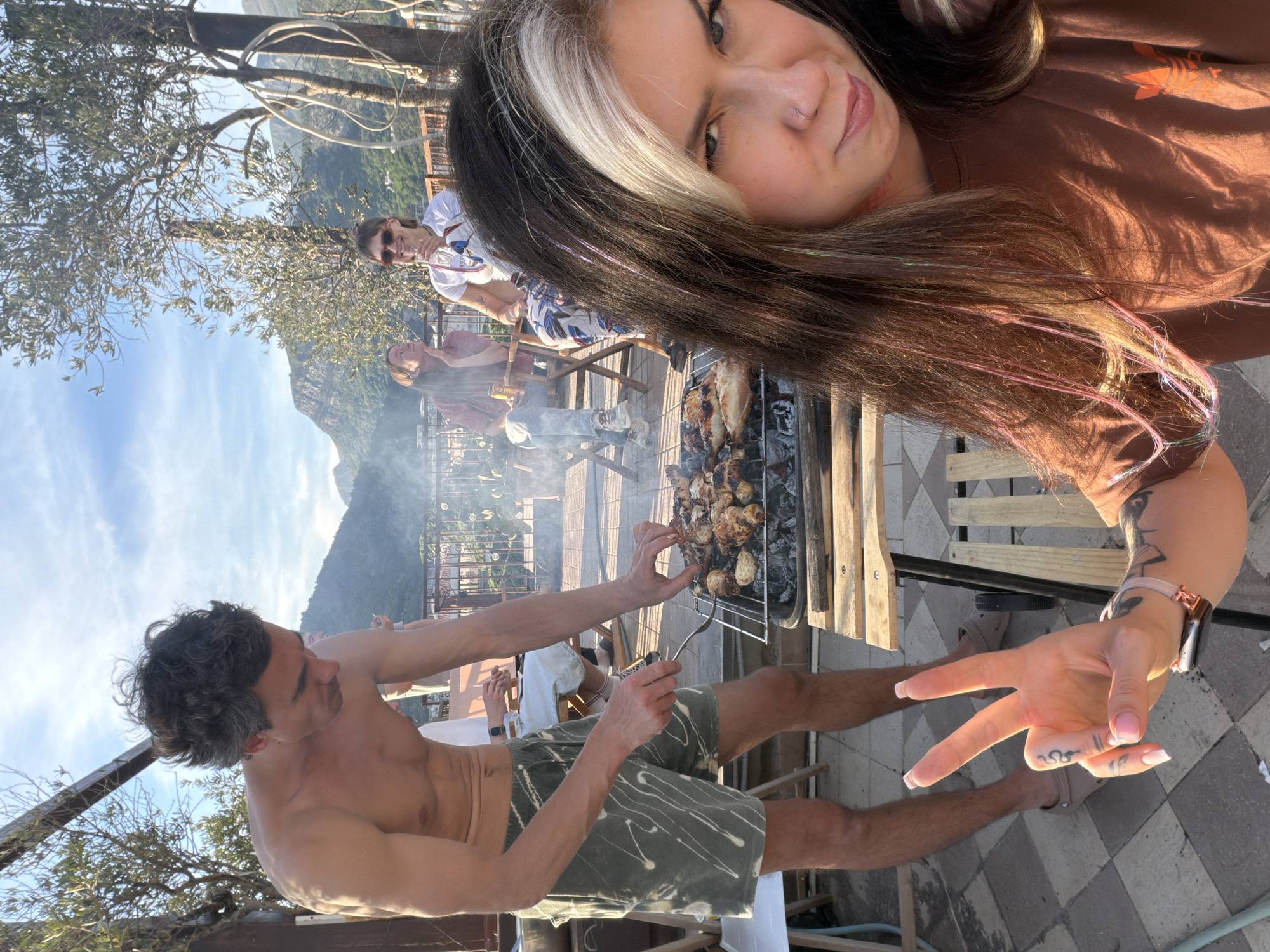 Friends gather for rooftop barbecue in Budva, Montenegro
