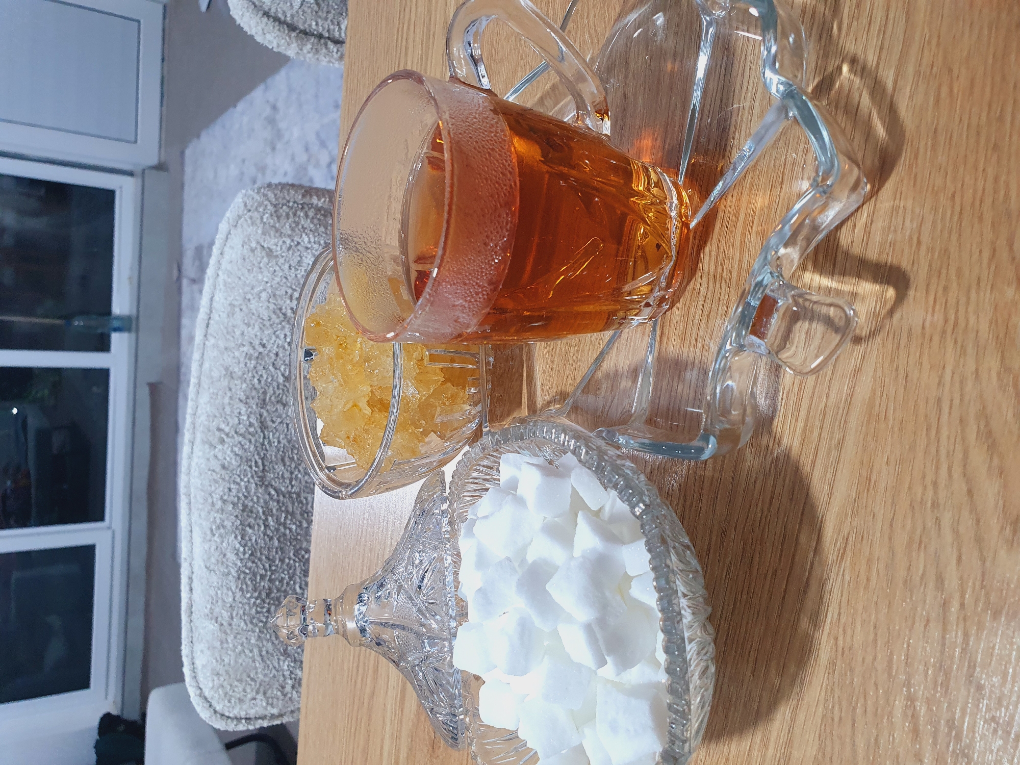 Home cook prepares spiced meal with tomato sauce and tea
