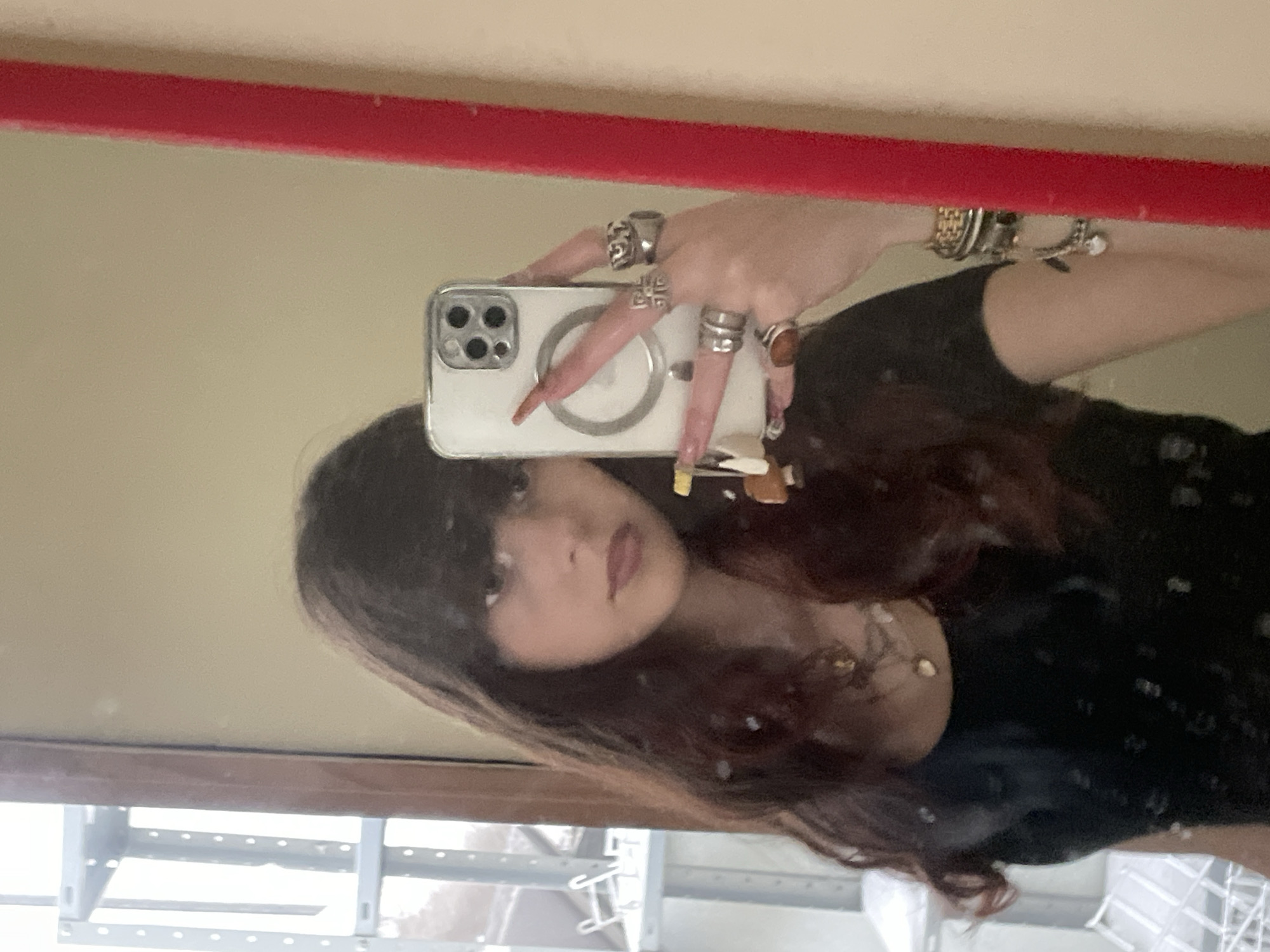 Woman takes mirror selfie in Raanana apartment