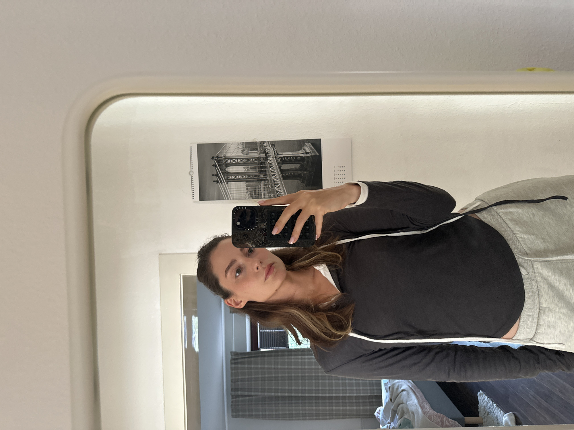 Woman takes selfies indoors in Kiel, Germany