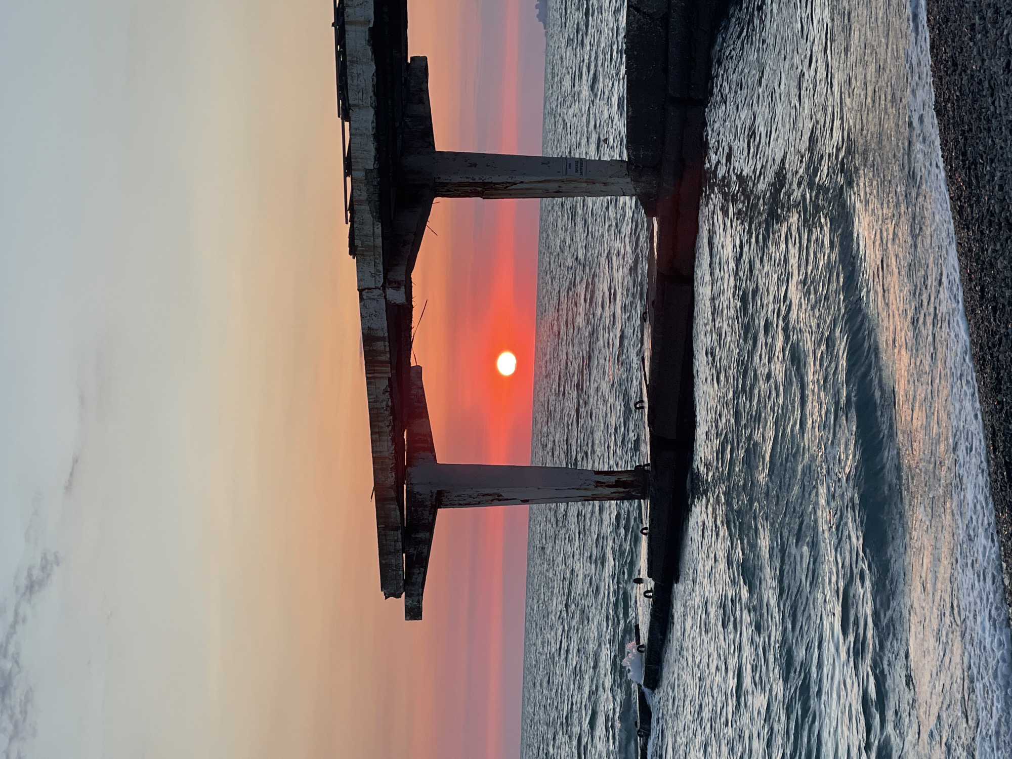 Red sunset over Sochi's Black Sea beach, early evening
