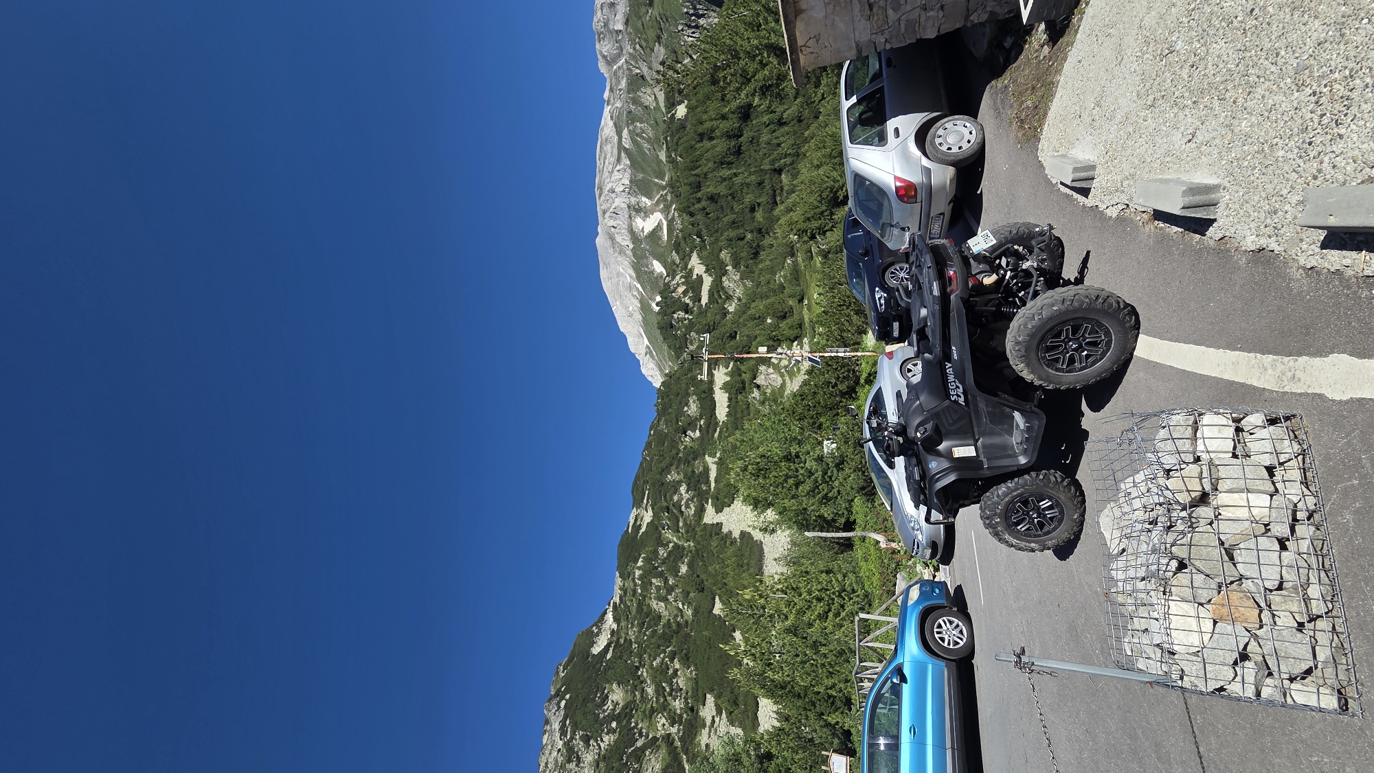 BMW and off-road Segway parked at a mountain stop in Bulgaria