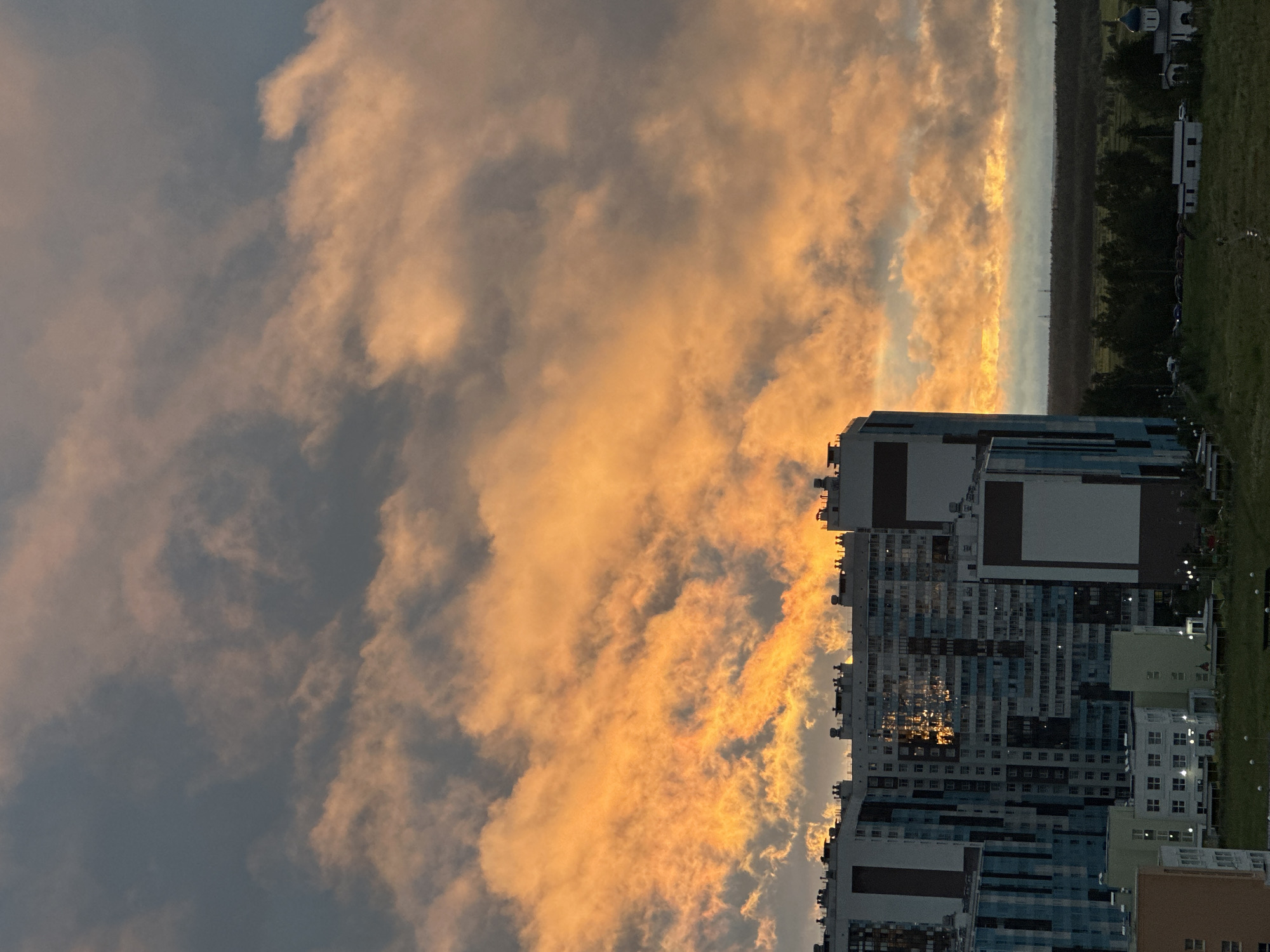 Saint Petersburg residential skyline at golden hour, July 2026
