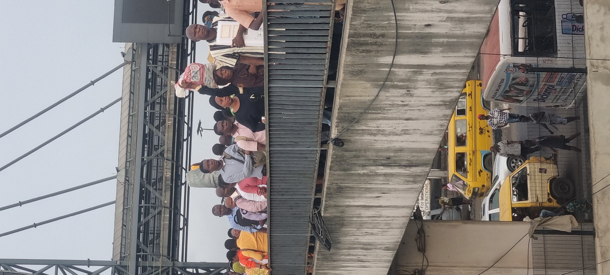 Morning crowds gather on Lagos bridges, damaged vehicle spotted