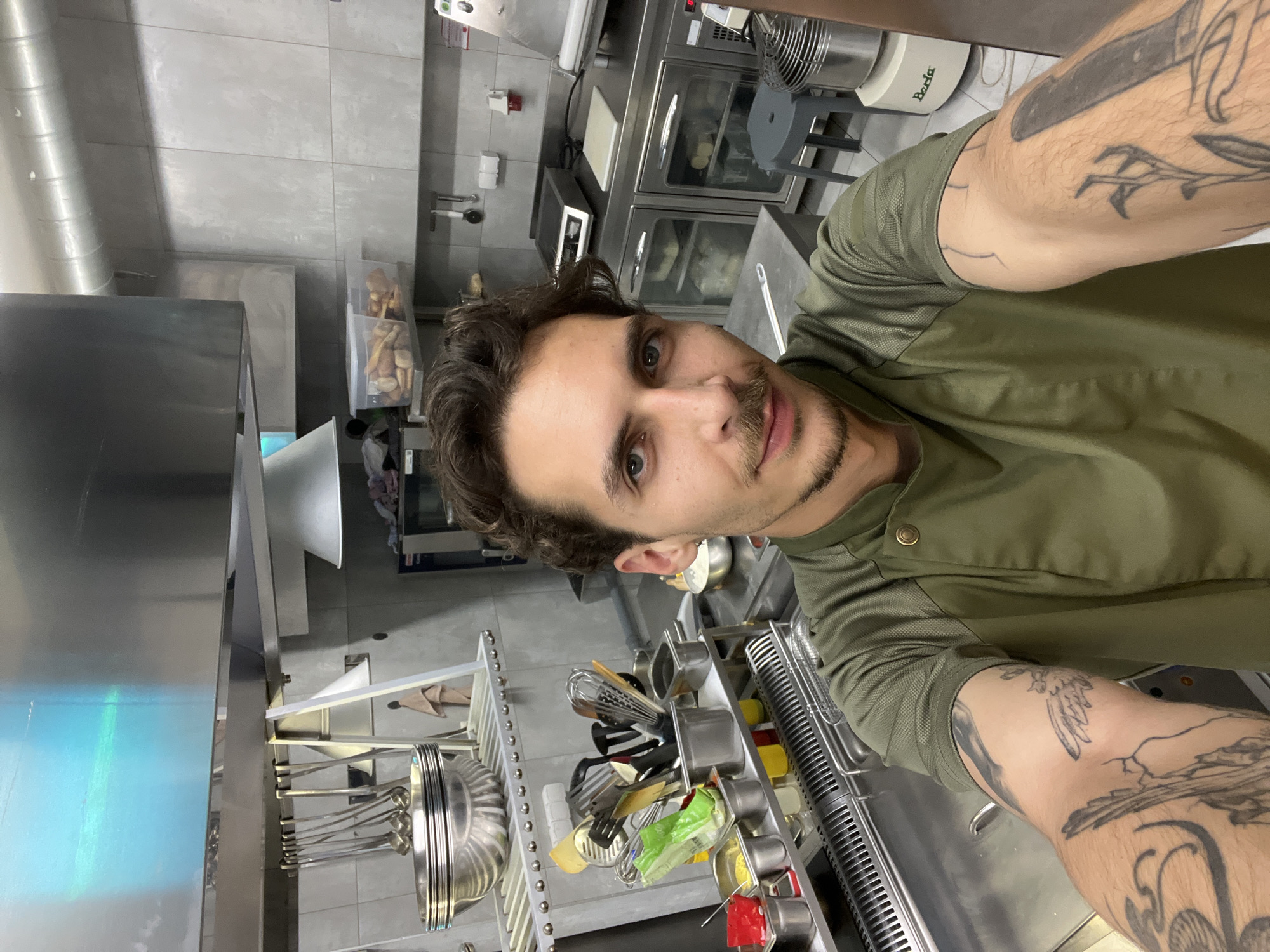 Chef takes selfie in commercial kitchen in Budva