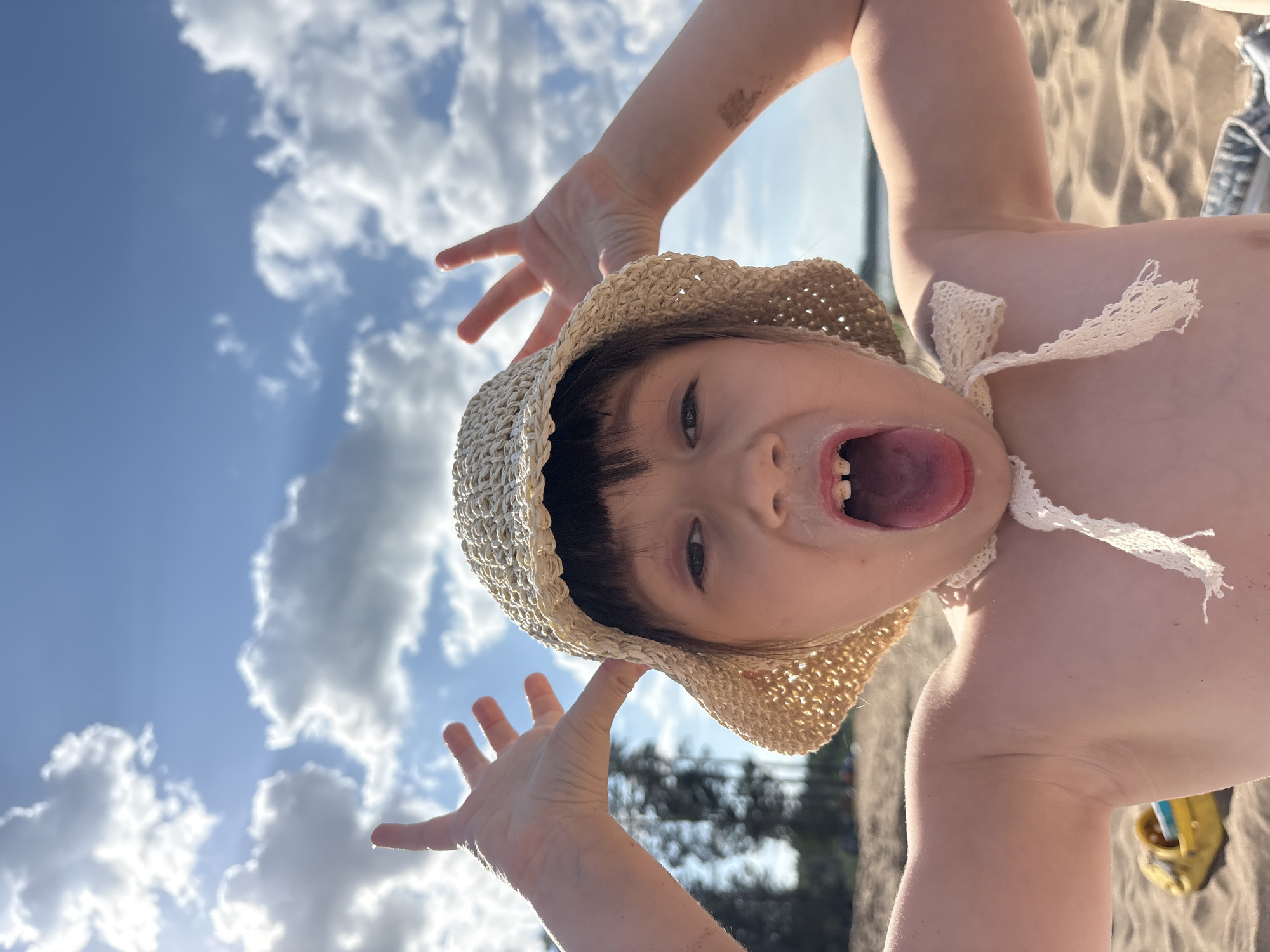 Child and dog enjoy beach day in Chaikovsky