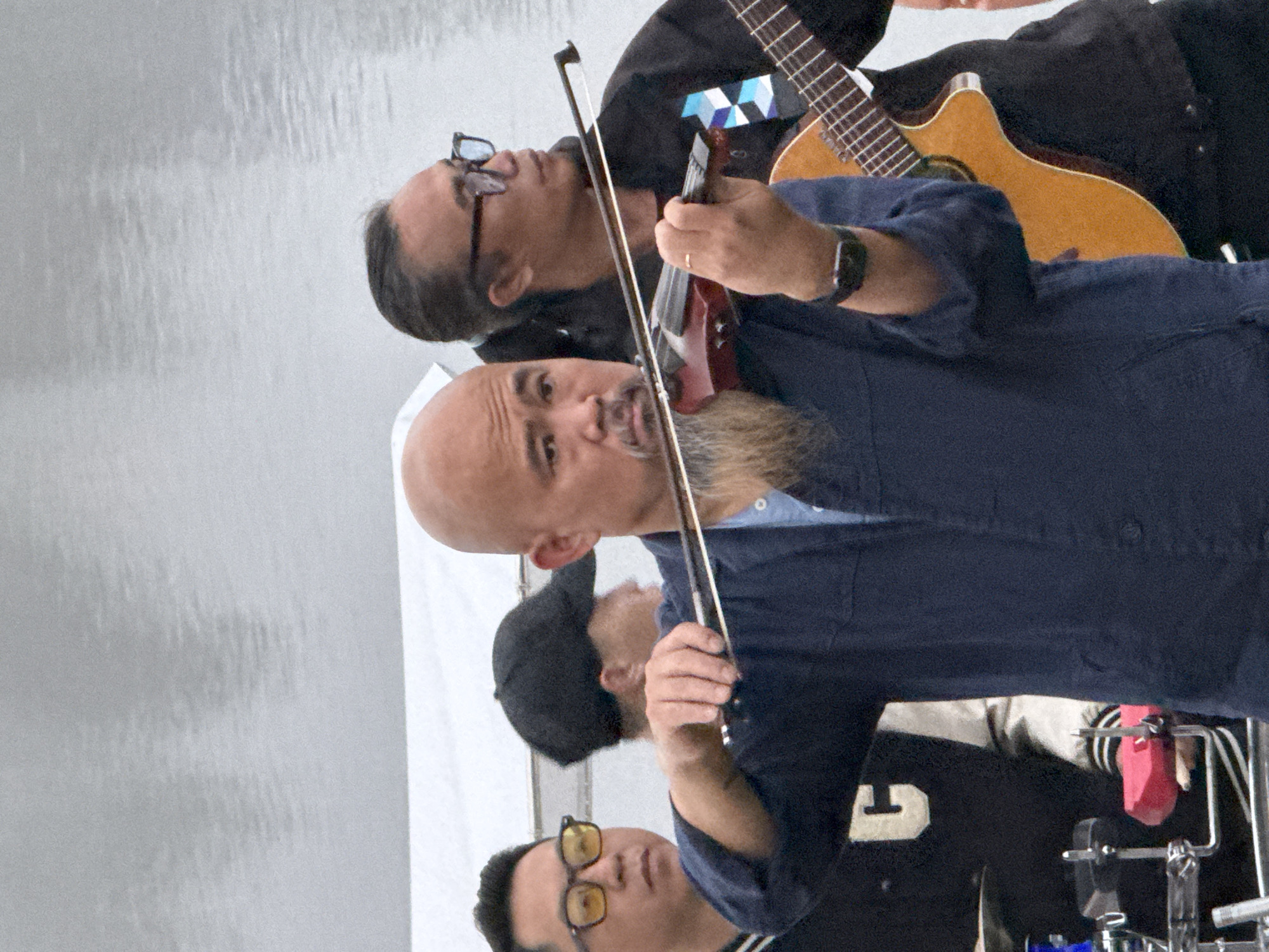 Live band plays lakeside in Da Lat on a grey evening
