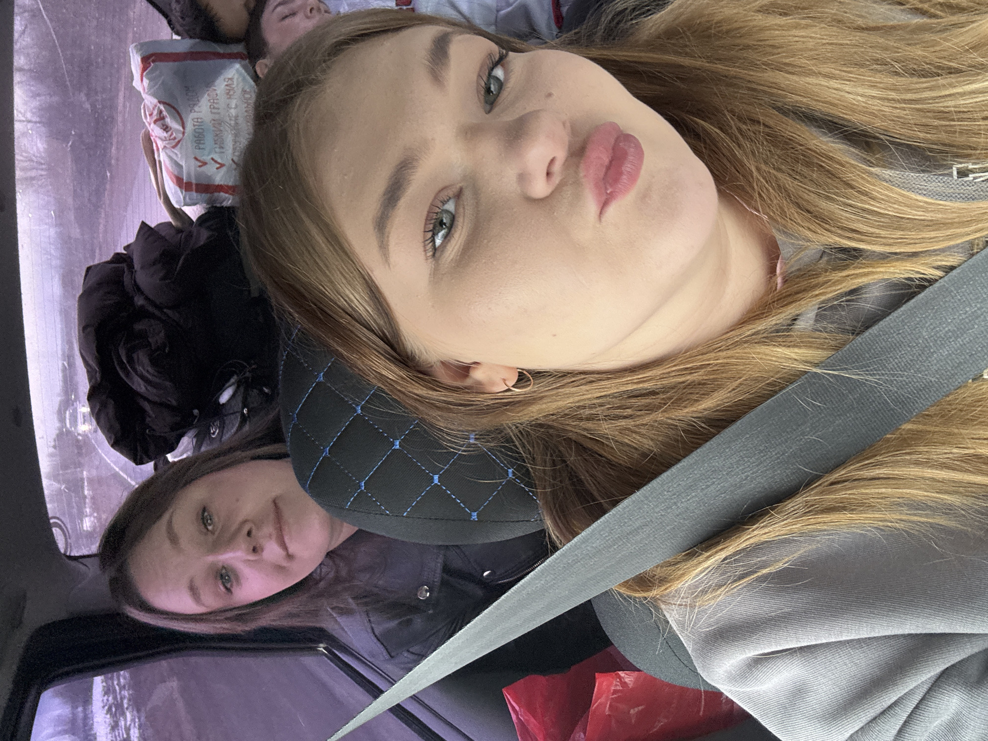 Two women photographed in car in Foteni, Russia