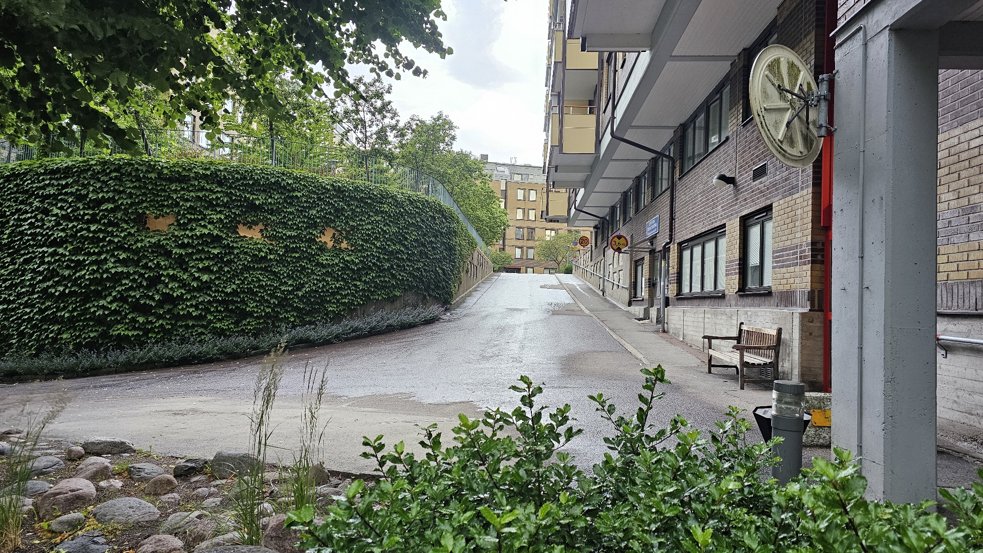 Wet streets and tram tracks through central Gothenburg neighborhoods