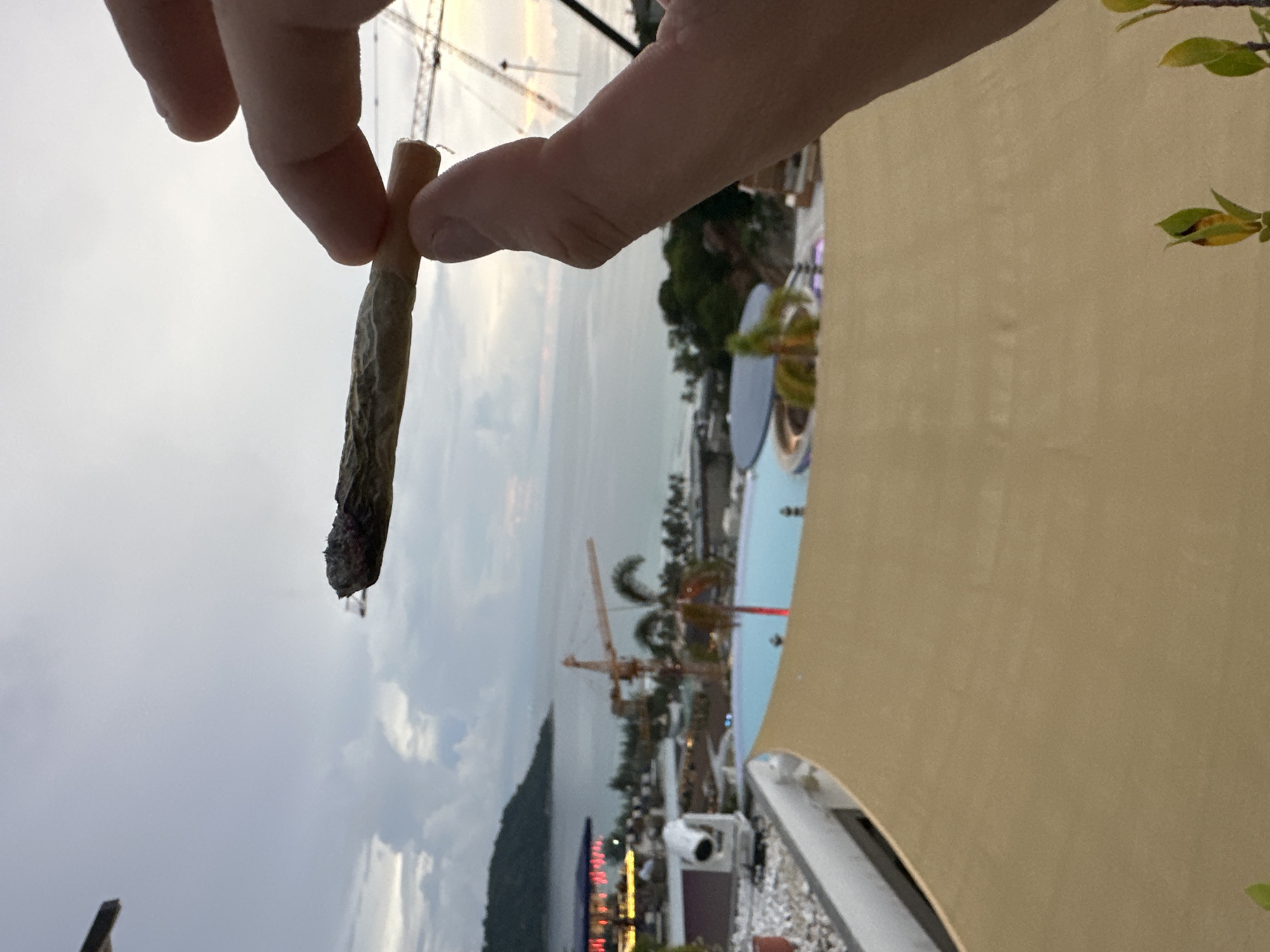 Rooftop pool day in Karon with coastal views and chill energy