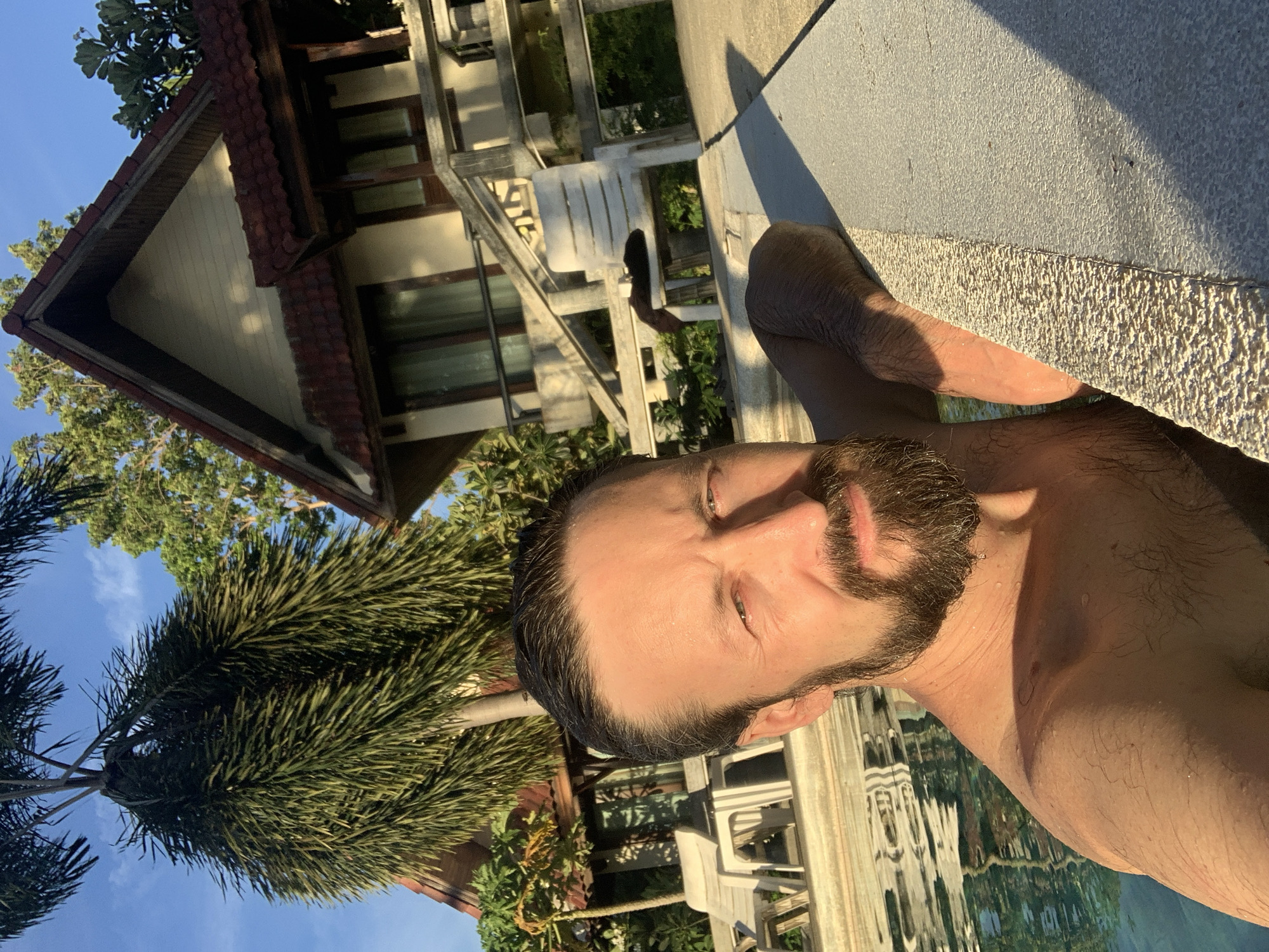 Poolside morning at a bungalow resort in Ban Bang Rak