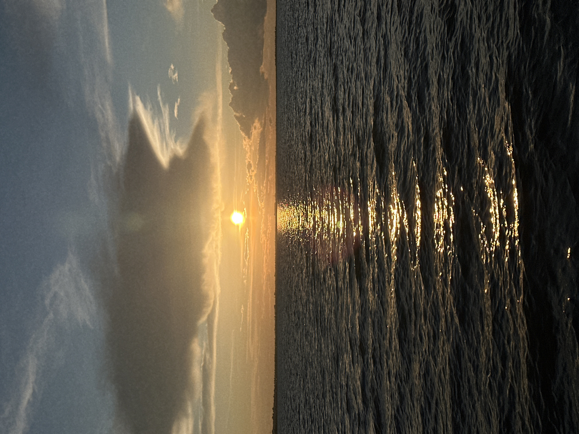 Golden sunset over dark water near Kokshetau, Kazakhstan