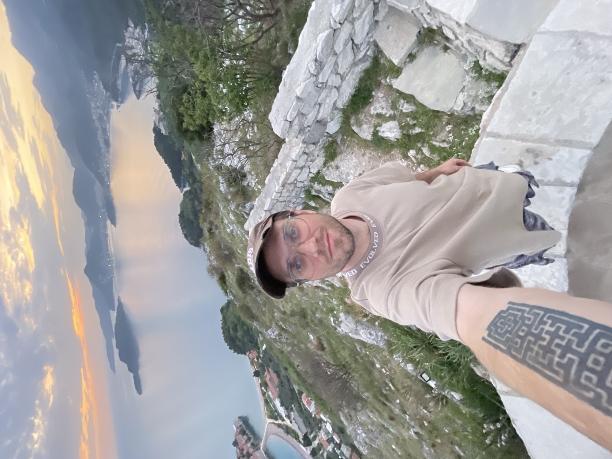 Tourist takes selfie at Sveti Stefan viewpoint, Montenegro