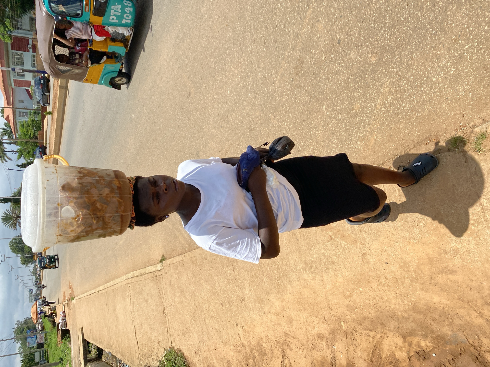 Street vendors and foot traffic on a busy Bukuru morning