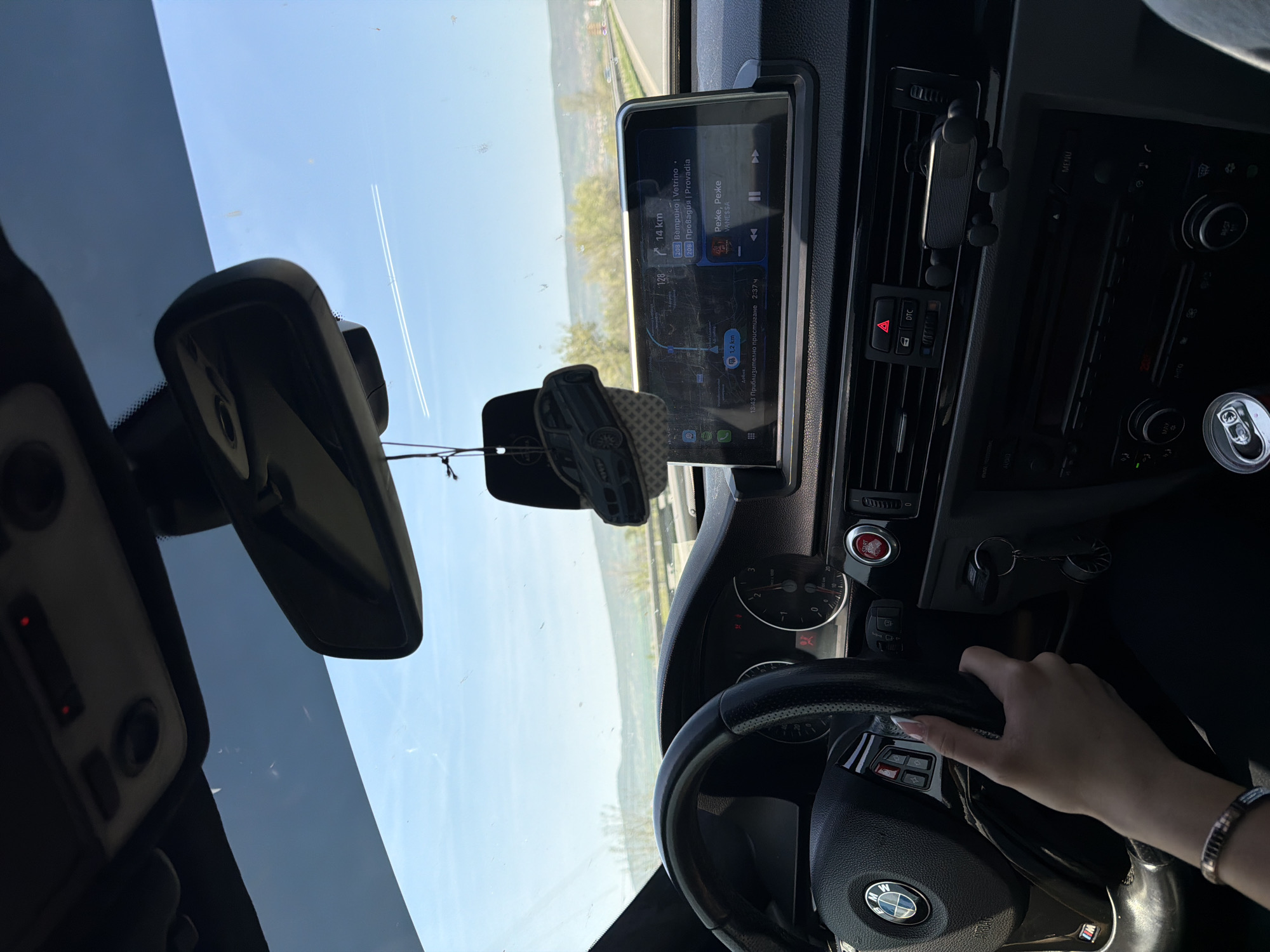 Driver uses GPS navigation in BMW near Devnya, Bulgaria