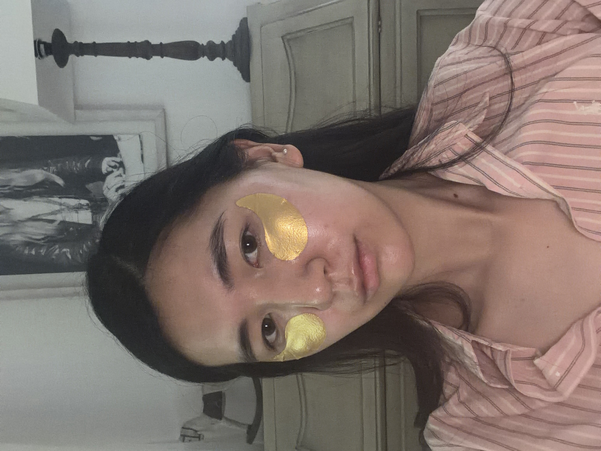 Woman in gold eye masks, striped pajamas observed in Grimaud