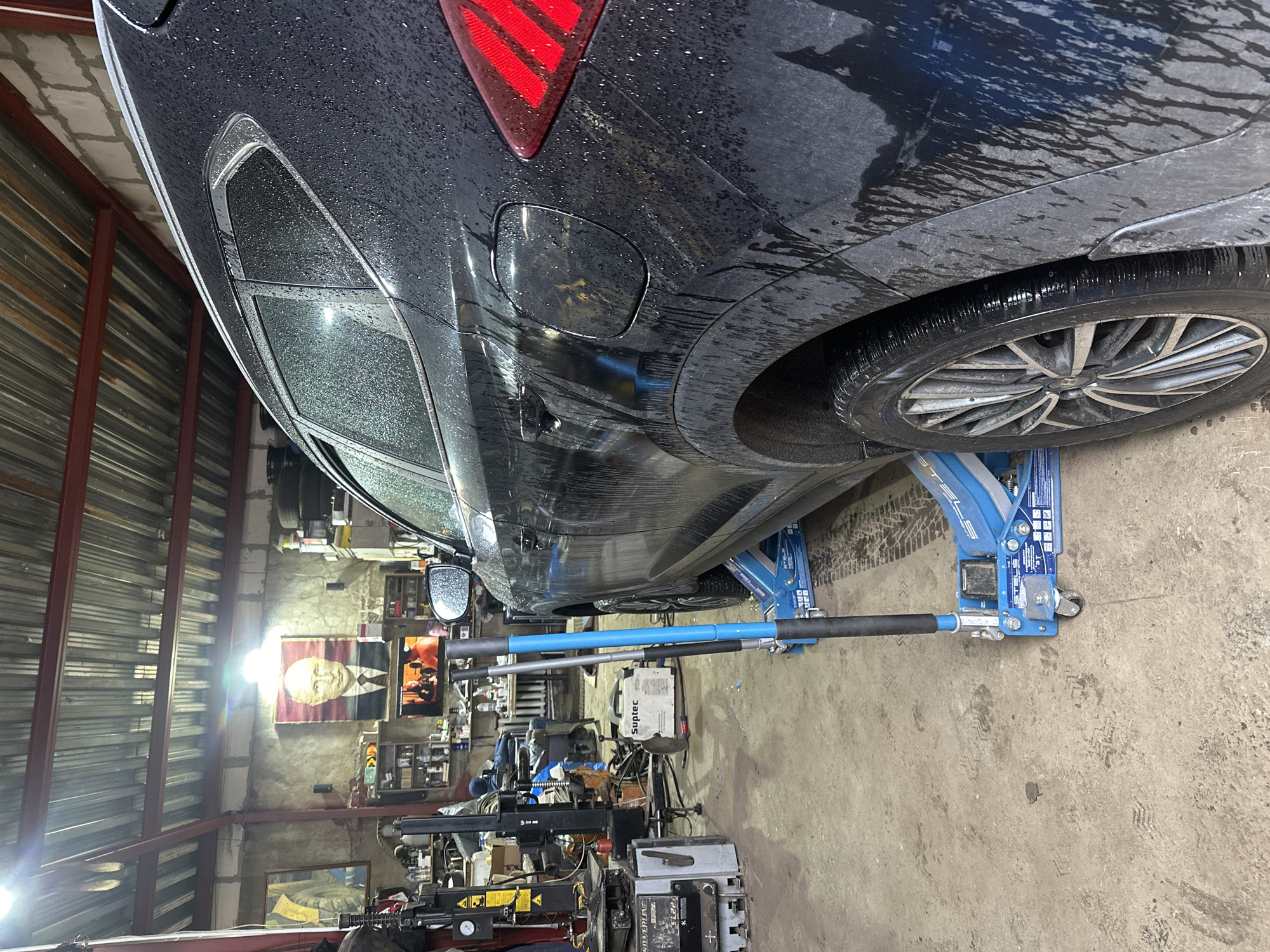 Car repair and chained dog scenes documented in Dubna