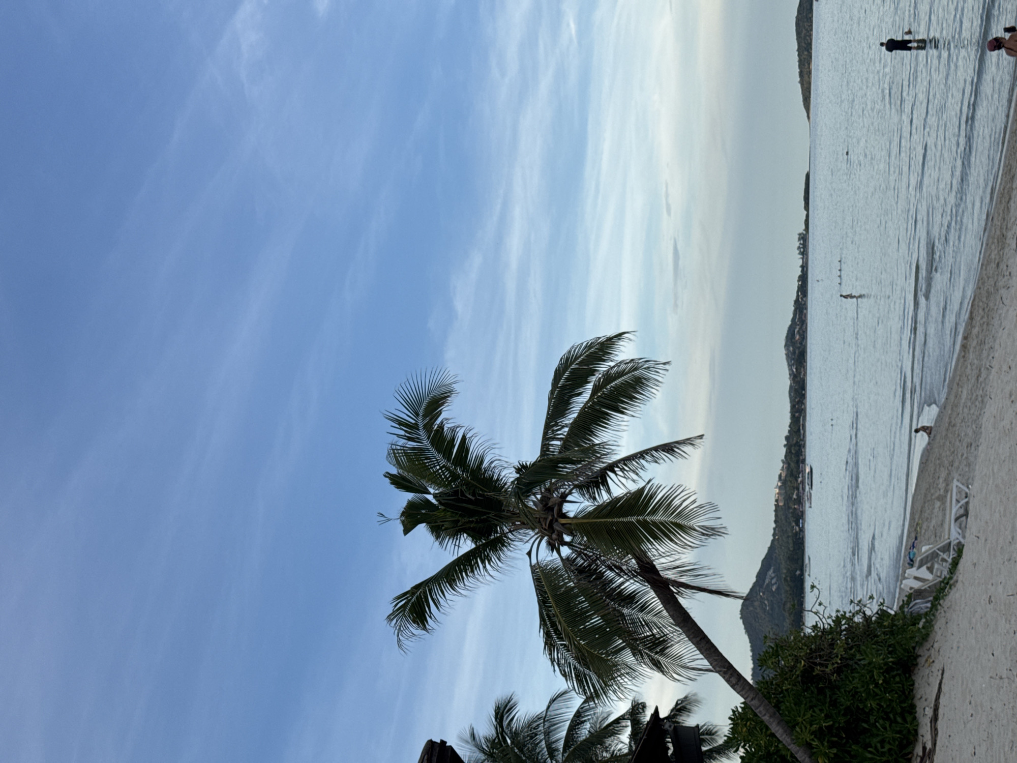 Lazy tropical beach day with shops, snacks, and ocean views