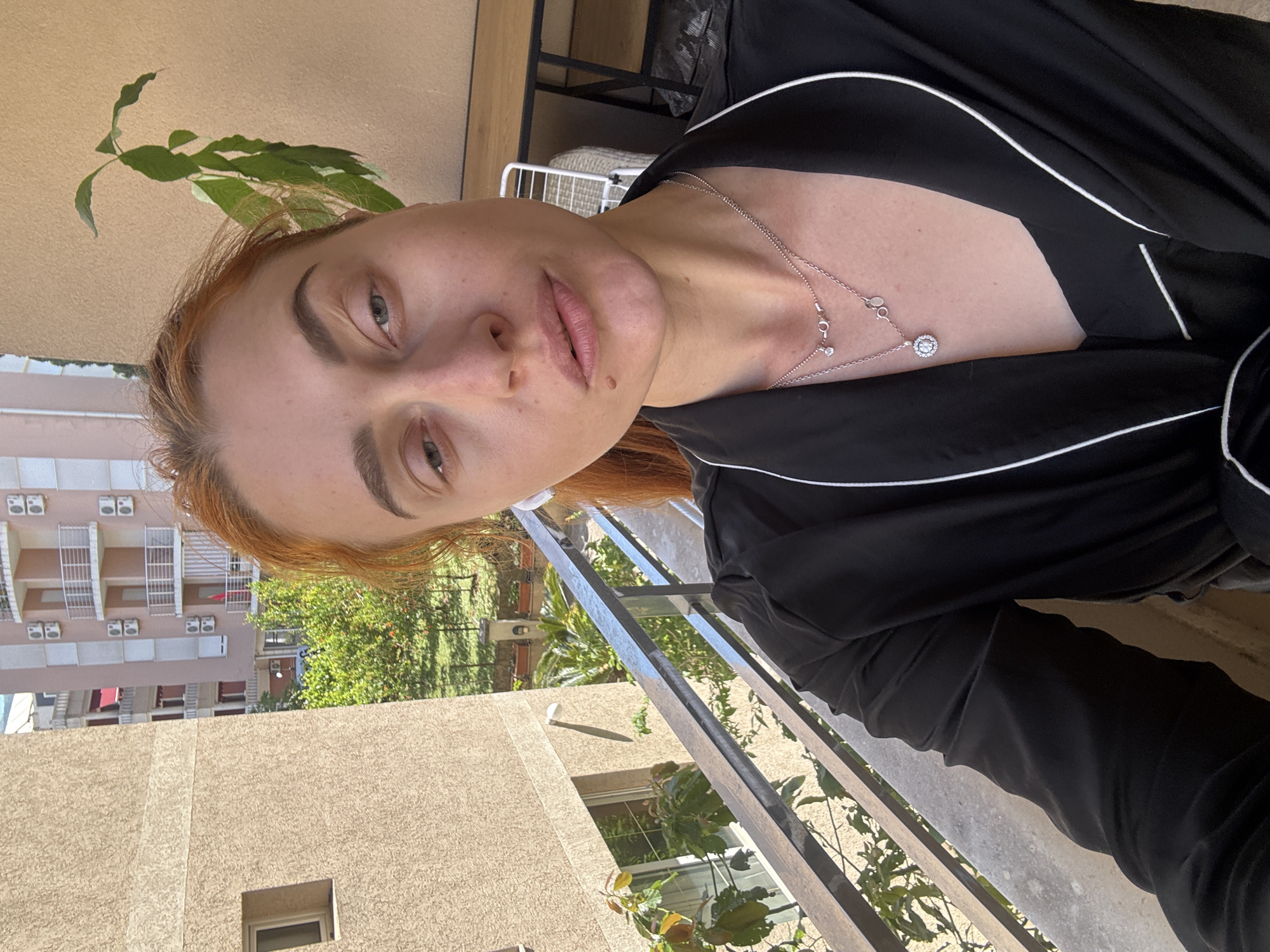 Woman Takes Morning Selfies on Budva Balcony