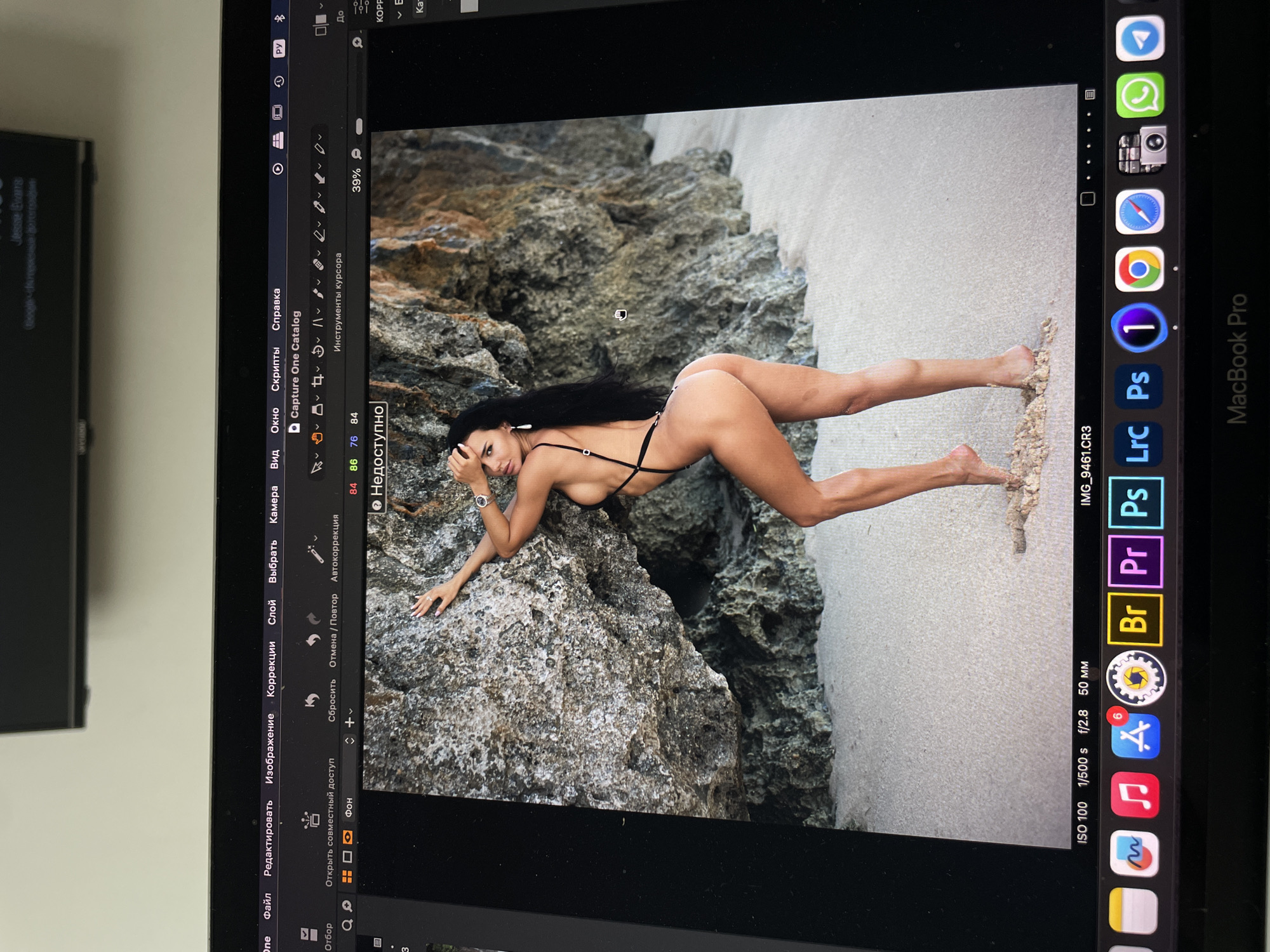 Photo editor processes swimwear photography in Kazan studio session
