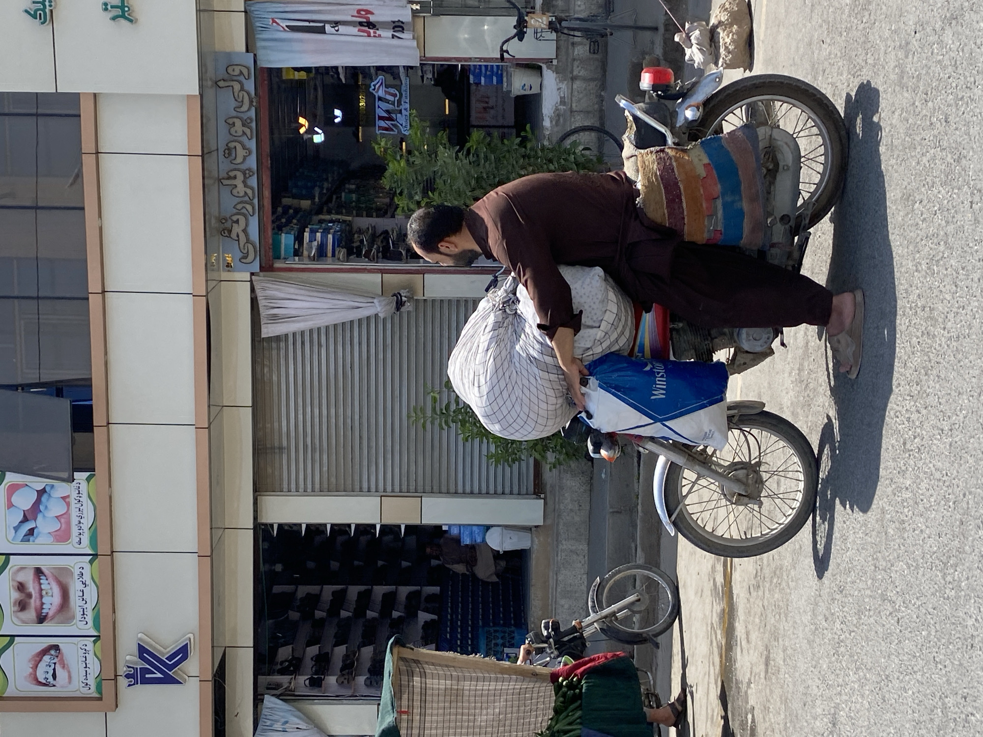 Street life and transit on a Kandahar road